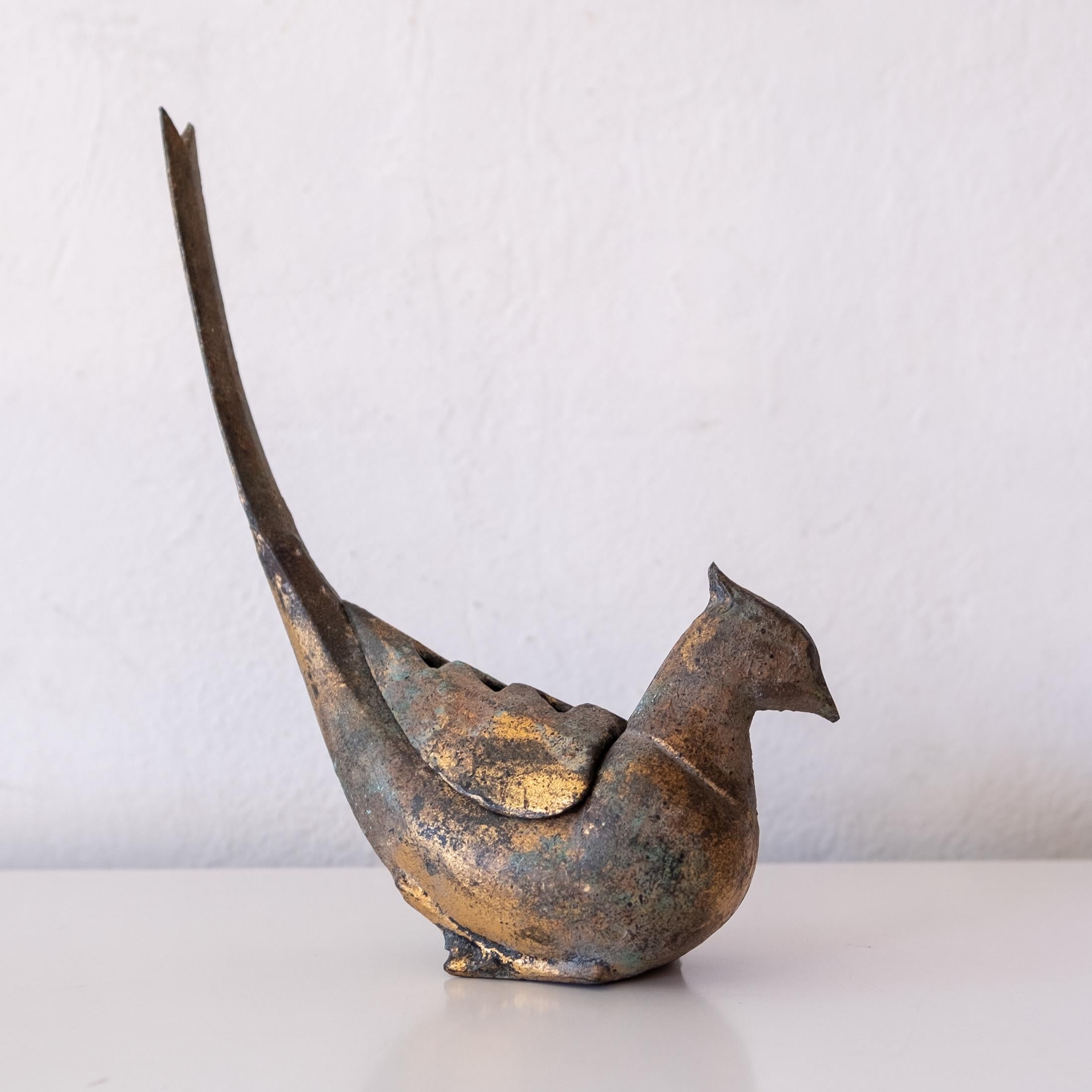 Iron bird sculpture with a nice patina. Removable vented piece, perhaps for burning incense or flower arrangements, 1950s. Iron bird sculpture with a nice patina. Removable vented piece, perhaps for burning incense or flower arrangements, 1950s.