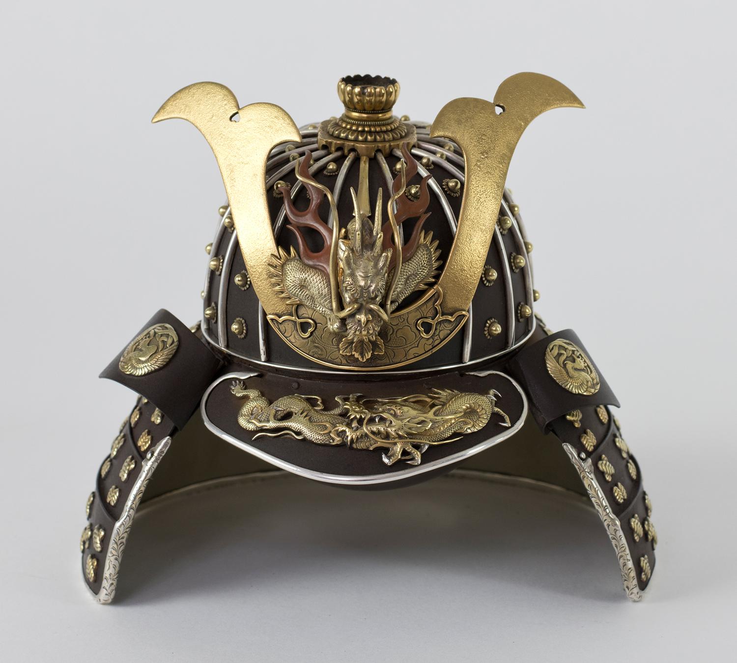 As part of our Japanese works of art collection we are delighted to offer this most unusual Meiji Period 1868-1912, iron and mixed metal koro in the form of a Samurai helmet (Kabuto), the unknown artist has used his metalworking skills to create a