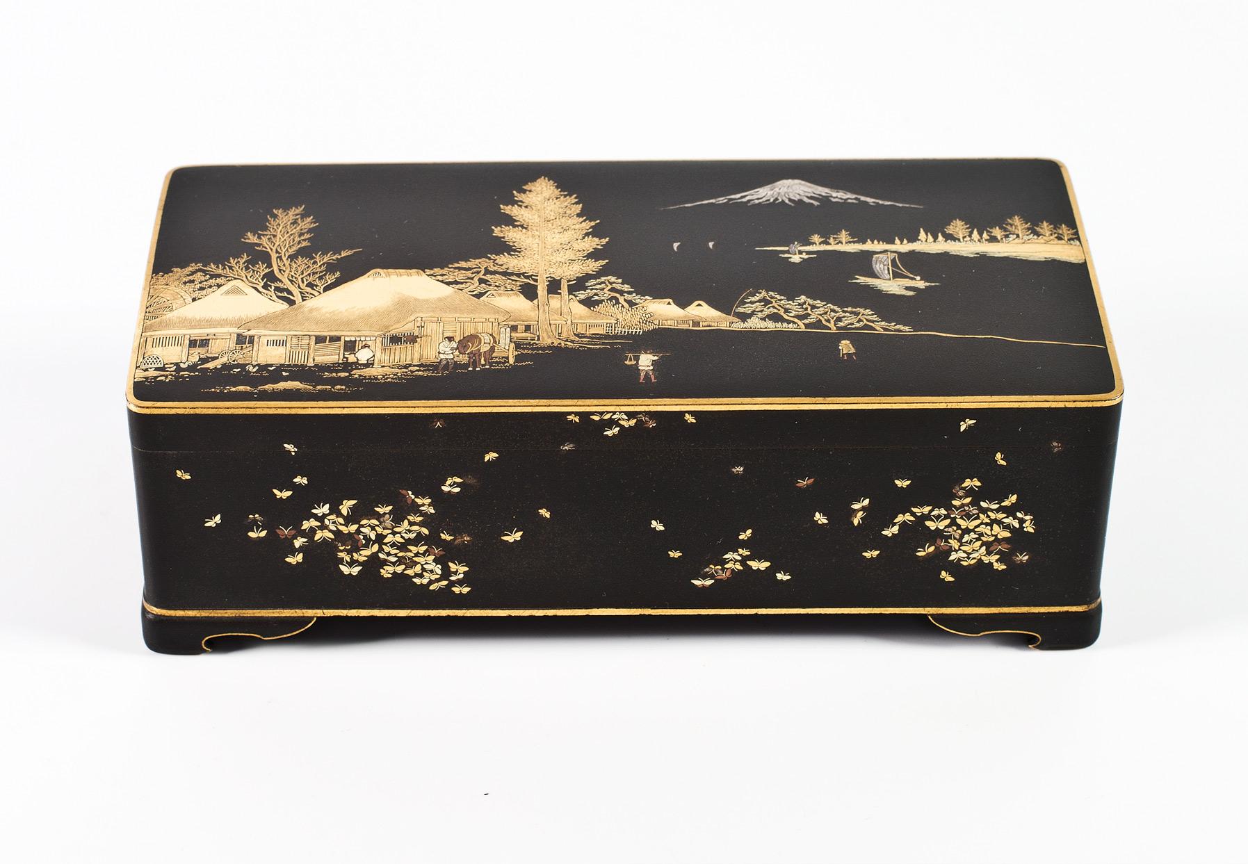 As part of our Japanese works of art collection we are delighted to offer this most unusual Meiji period 1868-1912 damascened iron box by the Komai company of Kyoto, the lid of the box is most unusually decorated with a horse outside a stable block