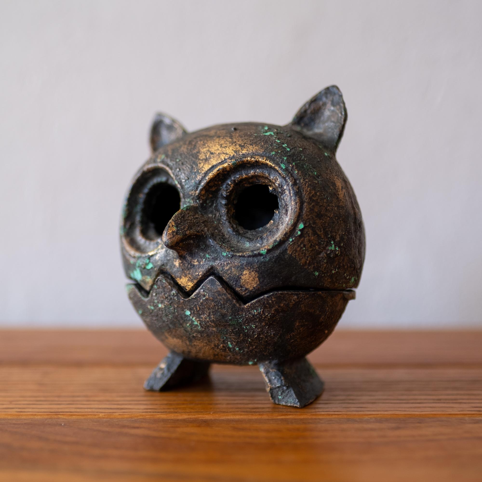 Iron owl sculpture with a nice applied patina. Removable top for use as a lantern or perhaps for burning incense. Marked Japan, 1950s.