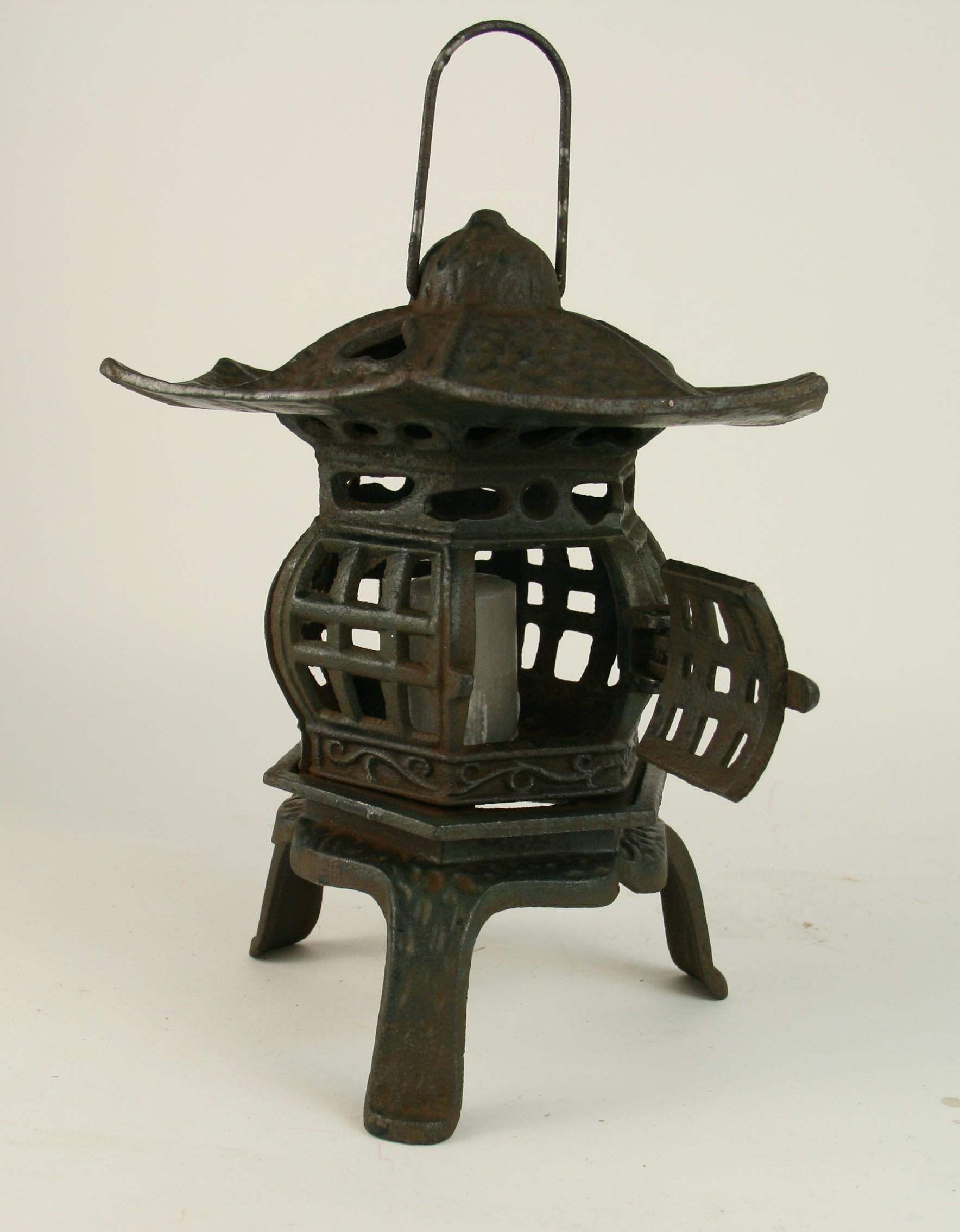3-422, Japanese iron pagoda garden candle lantern
Can rest on table or hanged by loop
Measures: Height to of loop 13