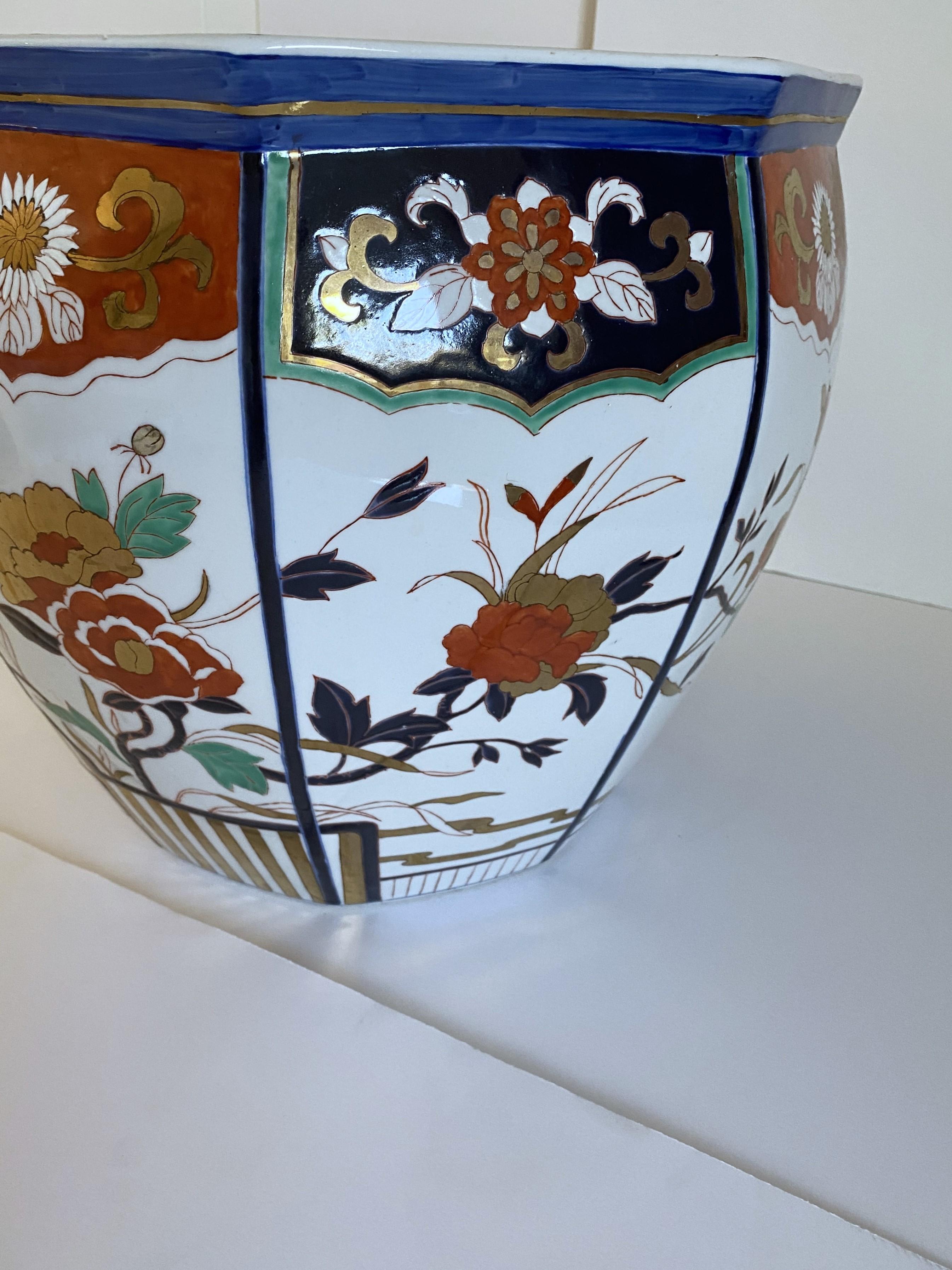A Japanese hand-painted porcelain jardiniere.