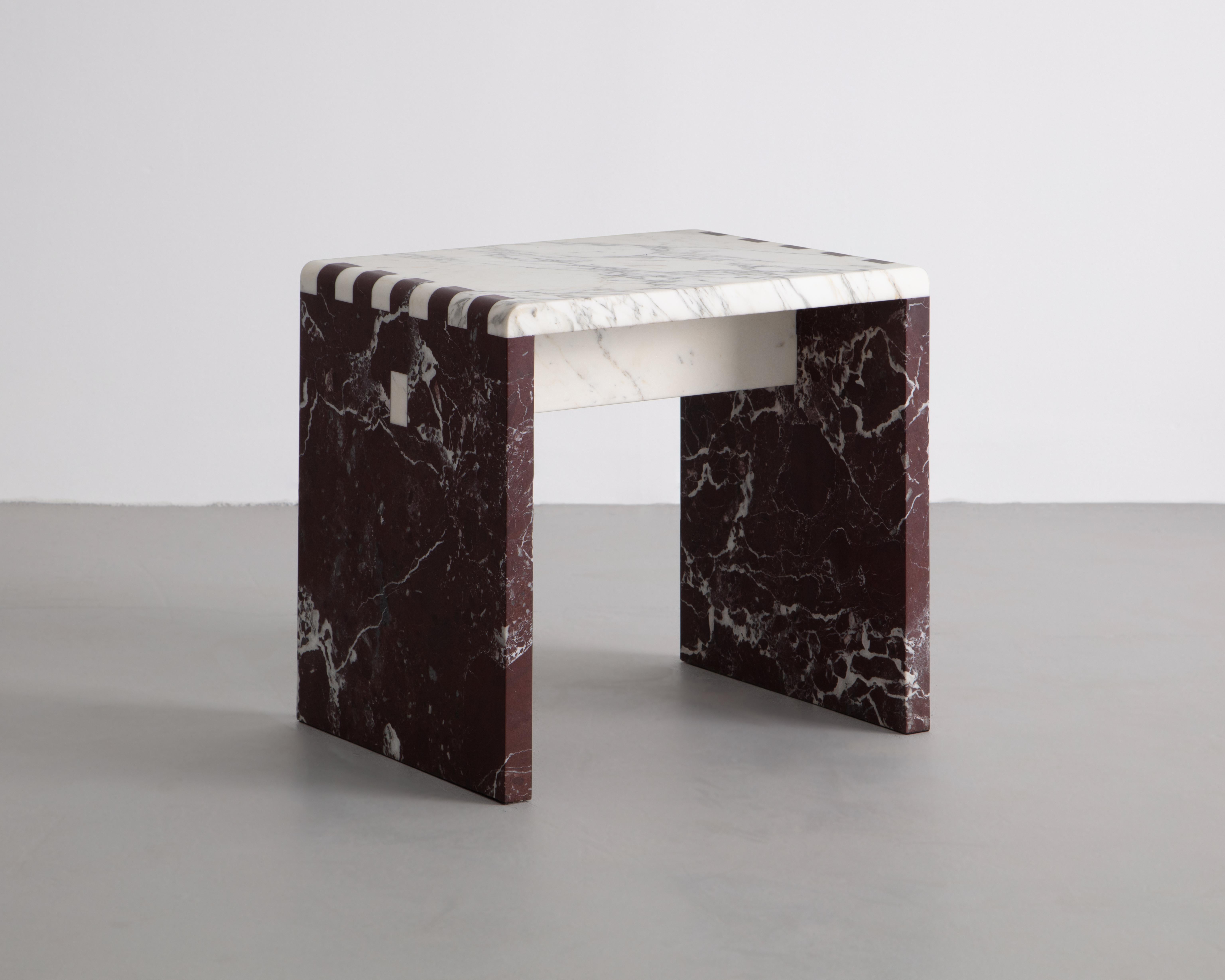 Inspired by traditional Japanese wood joinery, this minimalist stool/side table is a material study of stone. Shown in Calacatta Gold & Rosso Levanto Marble. 

Sure to make a statement for any environment.
 