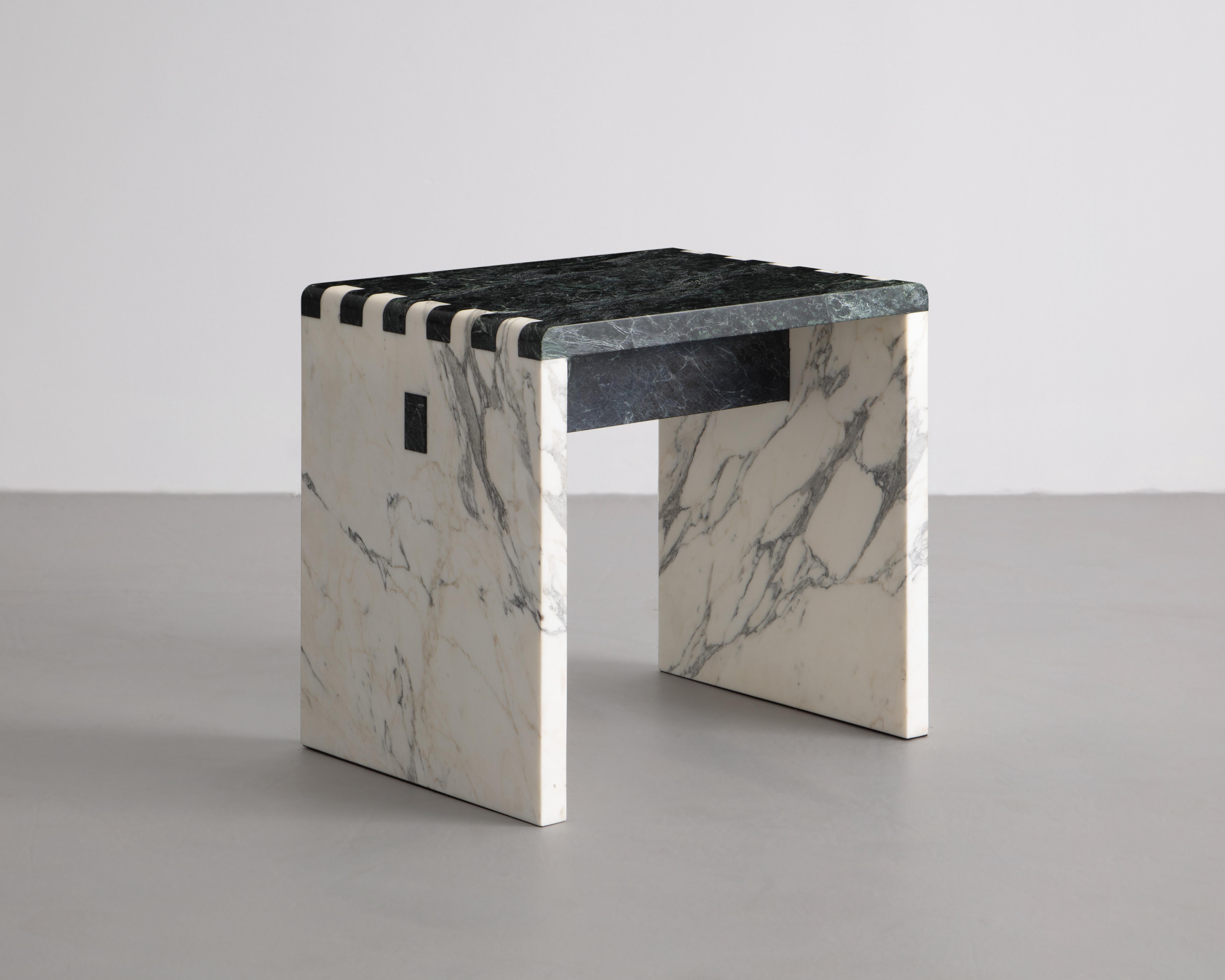 Inspired by traditional Japanese wood joinery, this minimalist stool/side table is a material study of stone. Shown in Calacatta Gold & Verde Green Marble. 

Sure to make a statement for any environment.
 