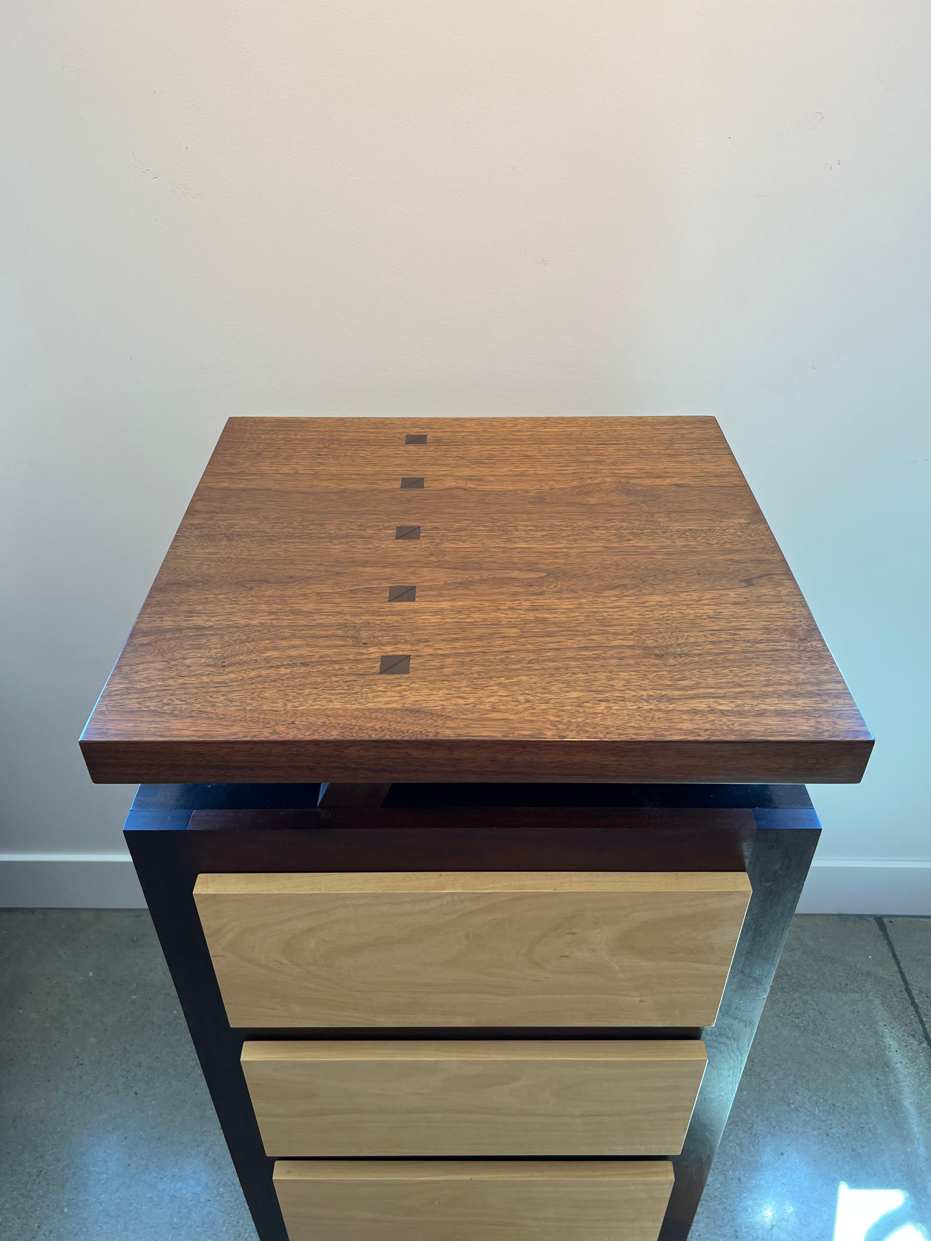 A beautifully crafted 3 drawer chest in the form of a Japanese Kanji Character by Stuart Welch a contemporary of Wendell Castlle.

Constructed from Ebonixzed Mahogany, Walnut, Ivorywood, Cedar Drawers 
M41.5?H x 22?W x 20?D

About the artist