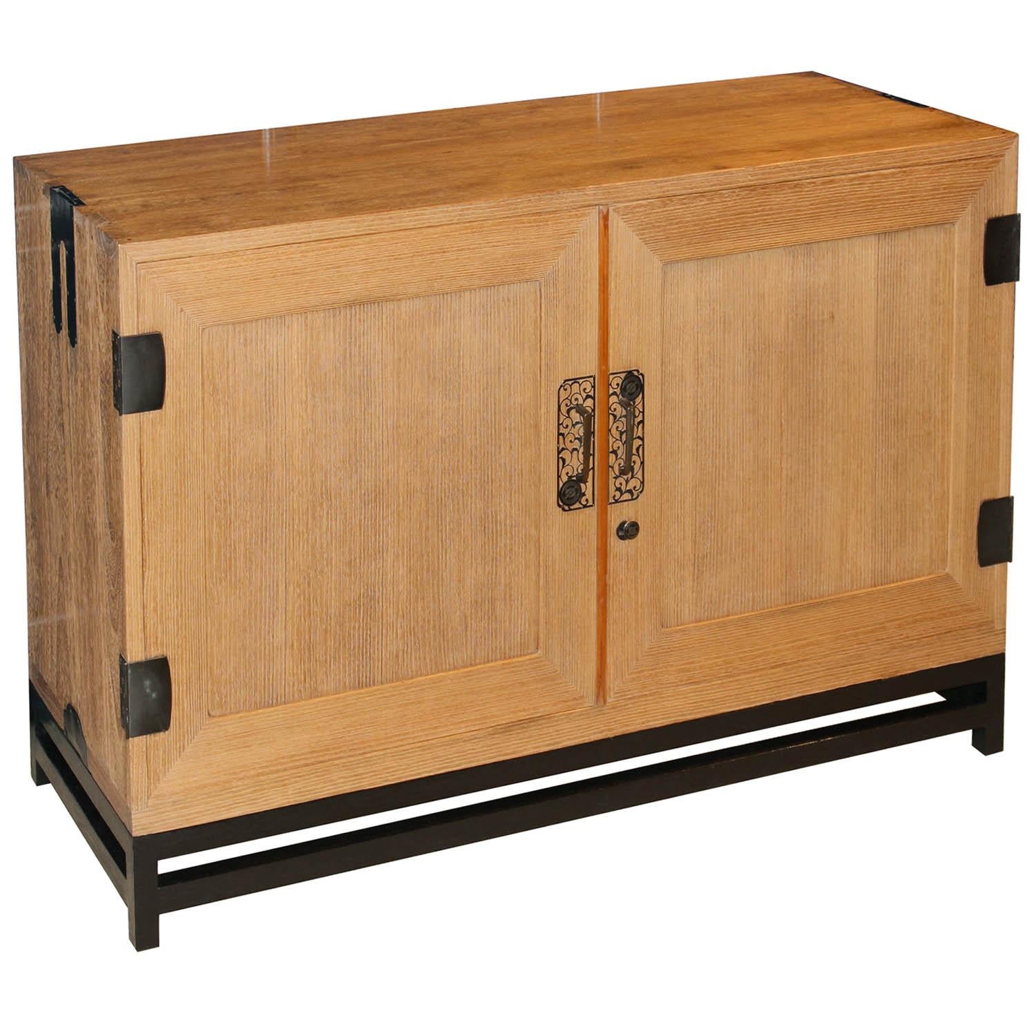Taisho period, circa 1920s, solid kiriwood kimono chest with sliding trays. With beautiful wood grain and copper hardware, featuring chrysanthemum lockplates, was used to store kimonos. Originally the middle portion of a three-section clothing