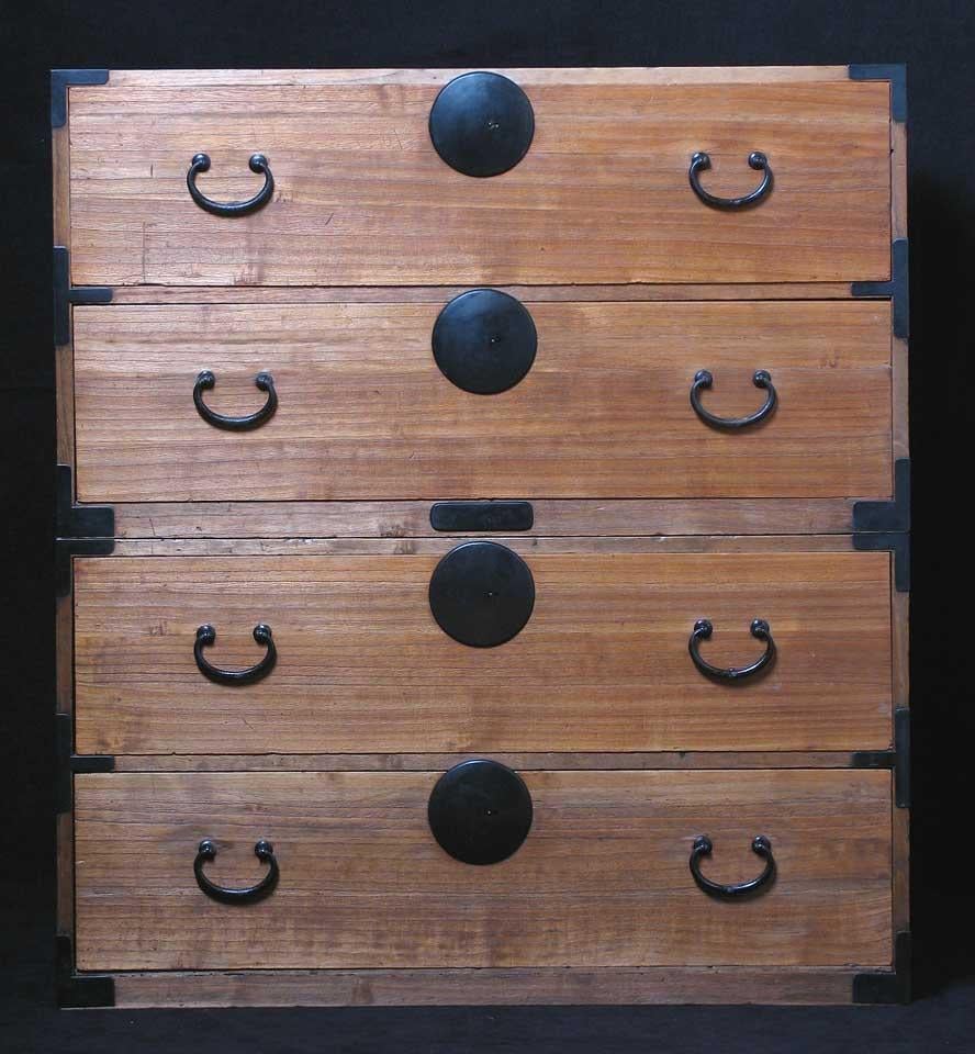 Japanese Isho Kasane-dansu (a stacking clothing chest), constructed entirely of kiri (Paulownia) with round iron lock plates and bale shaped handles, familiar to the Tokyo area, simple four drawer construction and each section is of equal