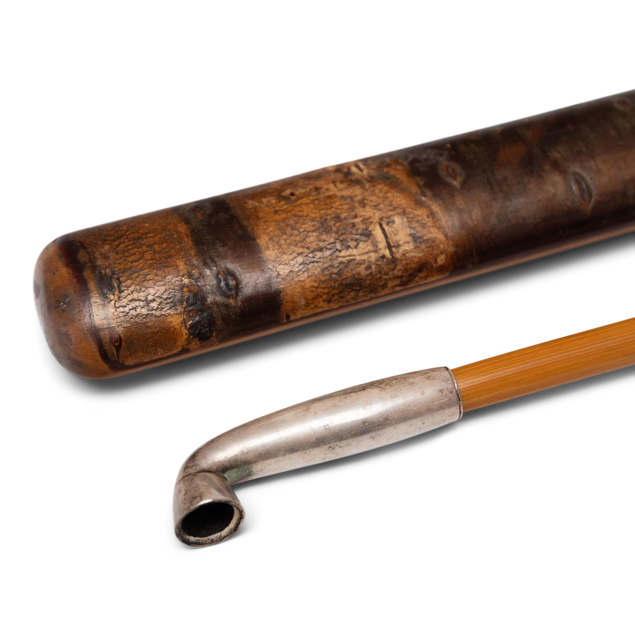 This elegant pipe of white brass and bamboo dates to early 20th century Japan and was used for smoking finely shredded tobacco (kizami-tabako). Known as a rao-kiseru, these short smoking pipes were comprised of hollow lengths of thin bamboo secured