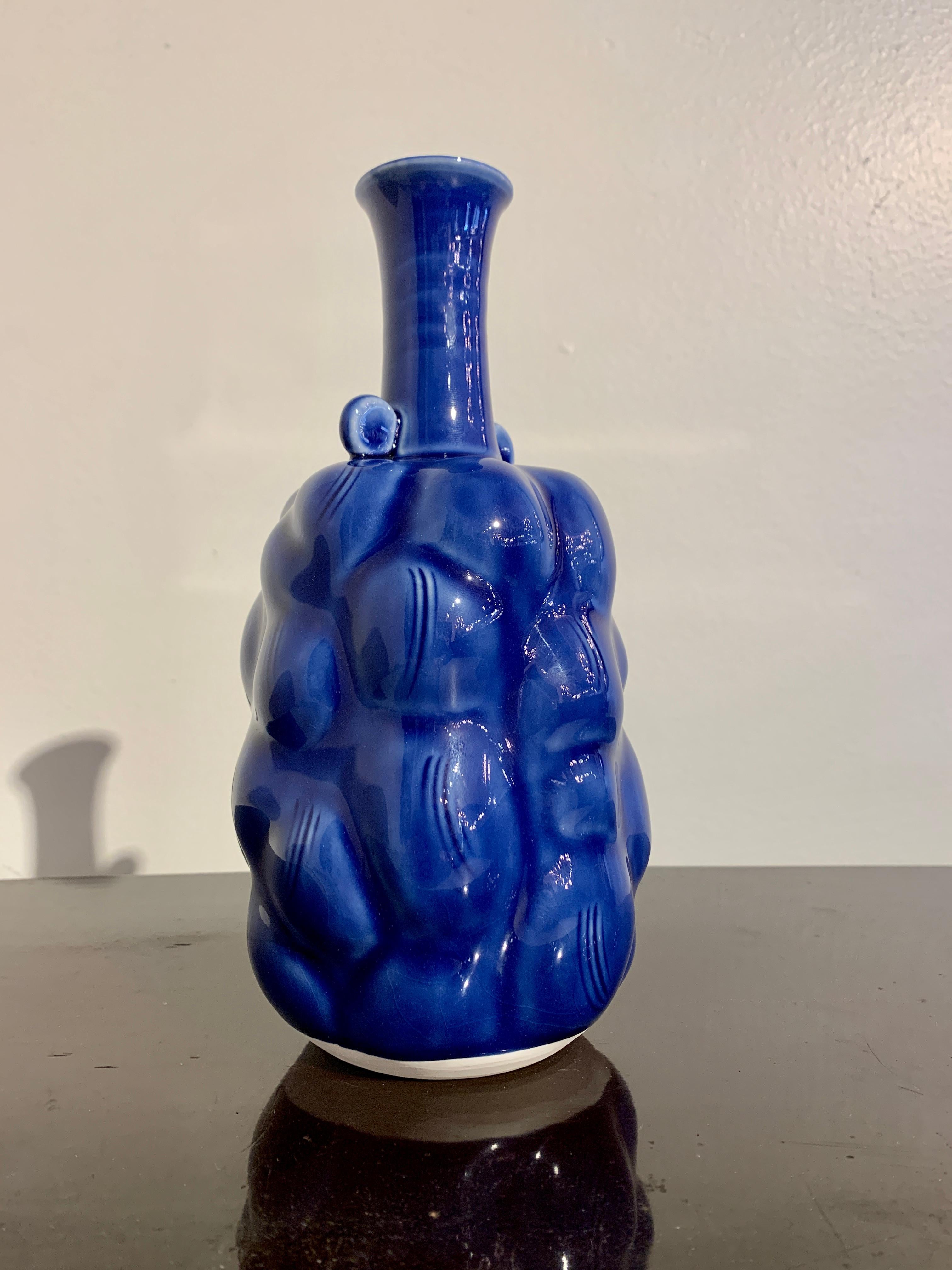 A wonderful Japanese contemporary Mino ware cobalt blue glazed vase from the Kobei Kilns, and attributed to the late National Living Treasure, Kato Takuo, (1917-2005). 

The vase of an unusual form, with large 