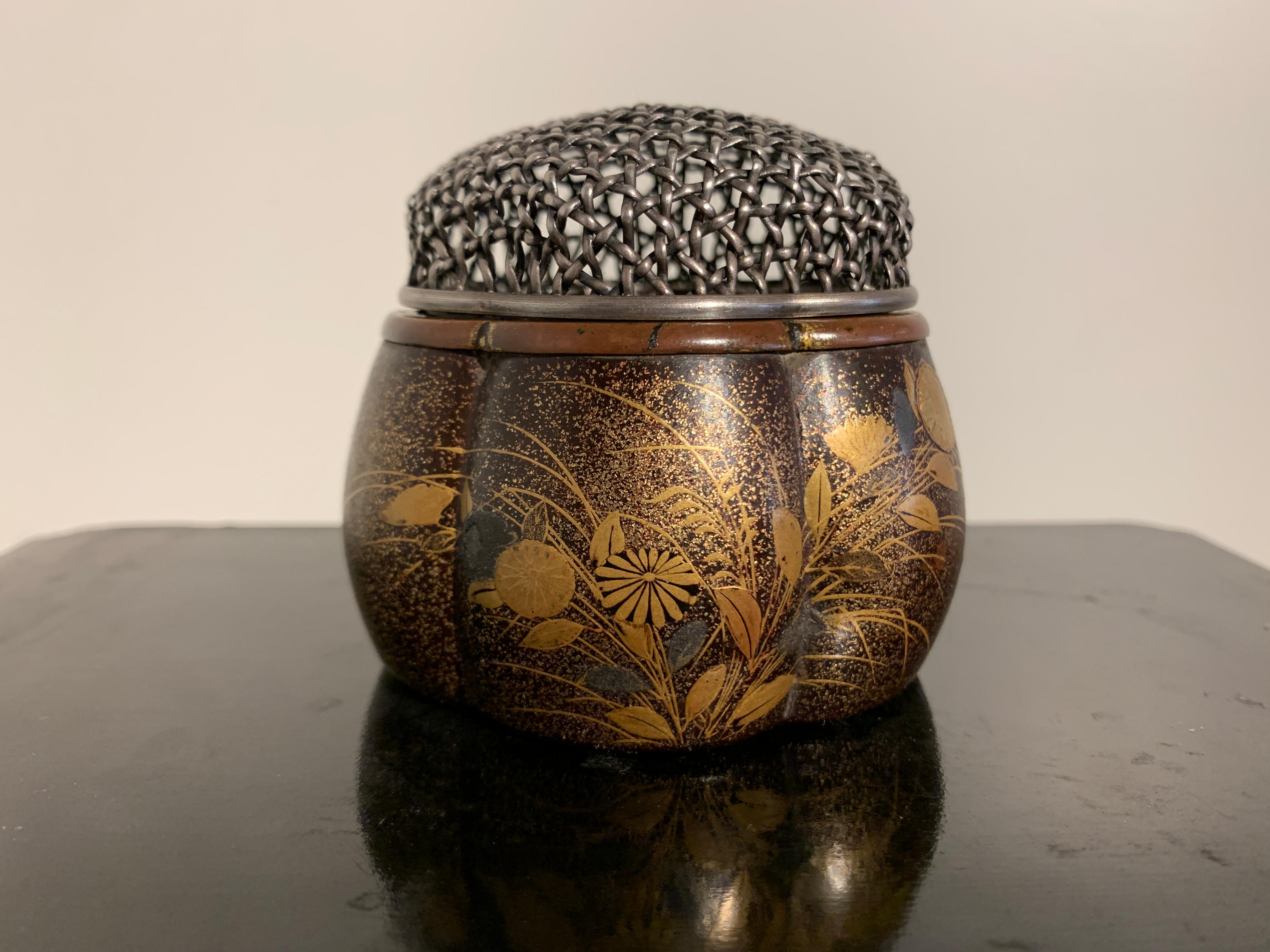 A fine and rare Japanese Momoyama Period (1573 to 1615), lobed lacquer incense burner, akoda koro, 16th-17th century, Japan.

The lobed censer, called an akoda koro (pumpkin or melon shaped incense burner), features a design of autumn grasses and