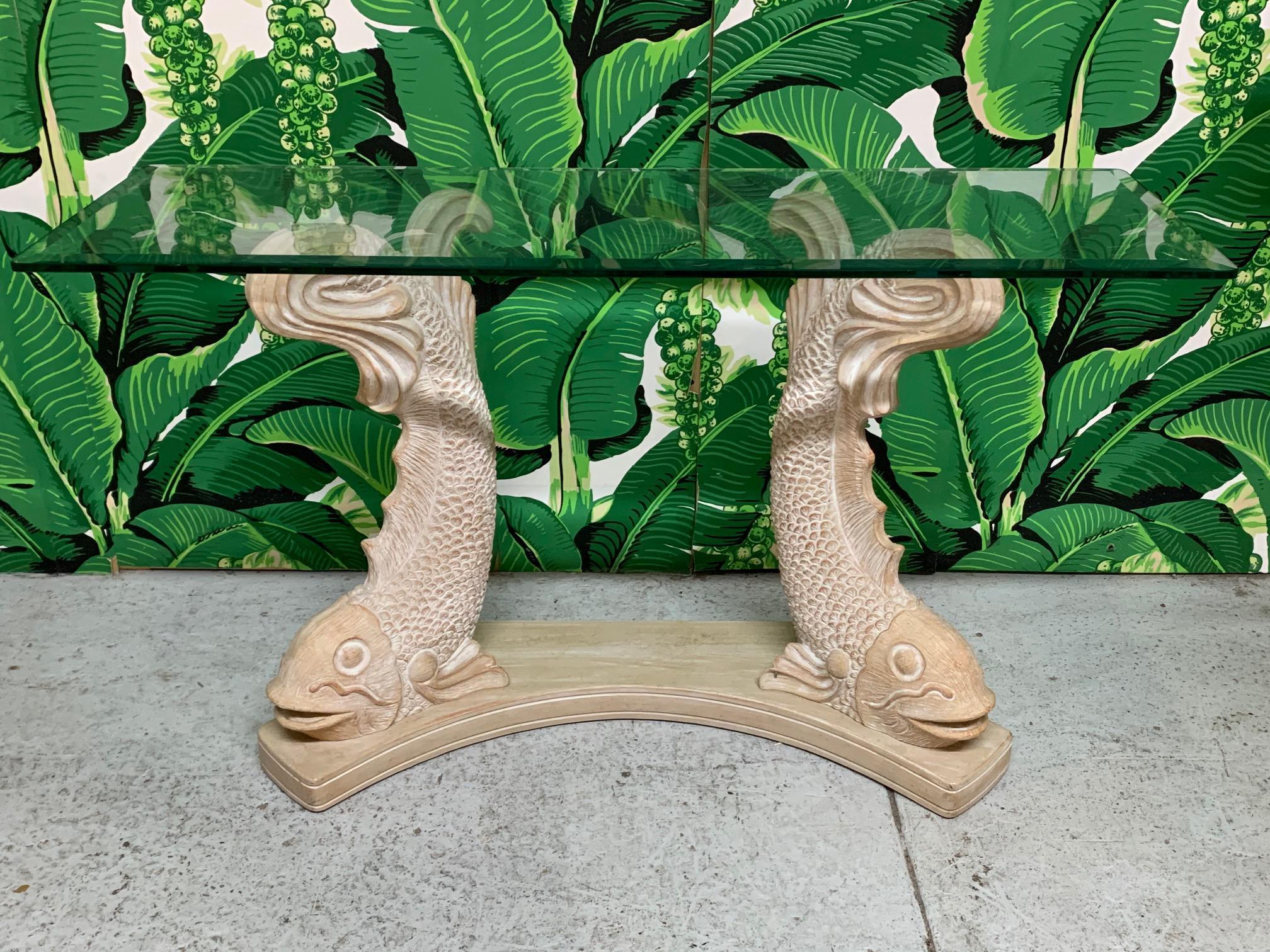 Sculptural console table in a Japanese Koi/Carp/Dolphin motif. Thick beveled glass top. Heavy plaster construction. Good condition with minor imperfections consistent with age, see photos for condition details.
For a shipping quote to your exact zip