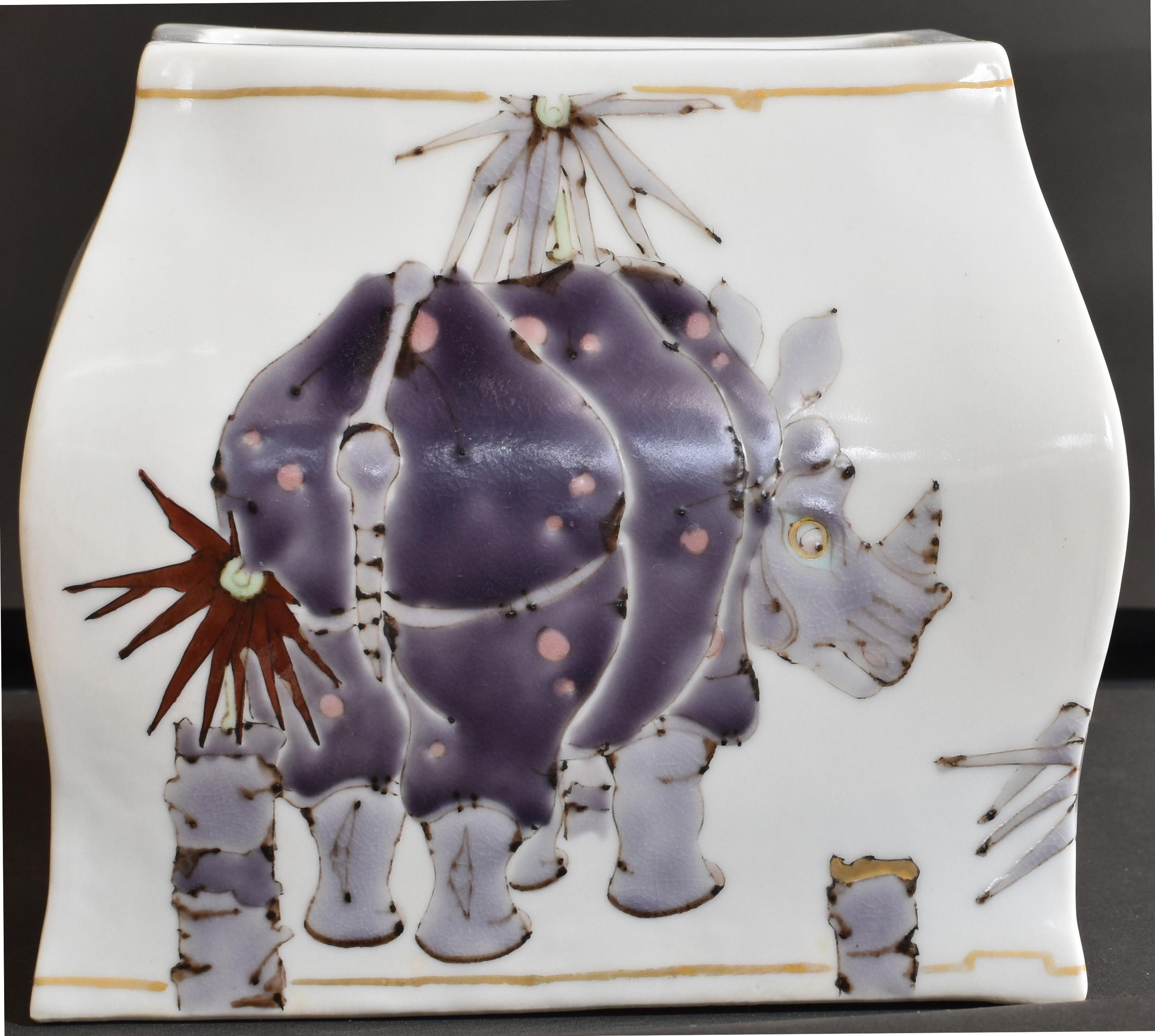 Exquisite contemporary Japanese decorative porcelain vase, stunningly hand-painted  in purple, blue and gray on an elegantly shaped body, with a unique interpretation of the rhinoceros.
The highly acclaimed artist has drawn on various animals