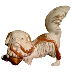 Japanese Kutani Porcelain Pekinese Dog Playing with Shinto Shrine Bell