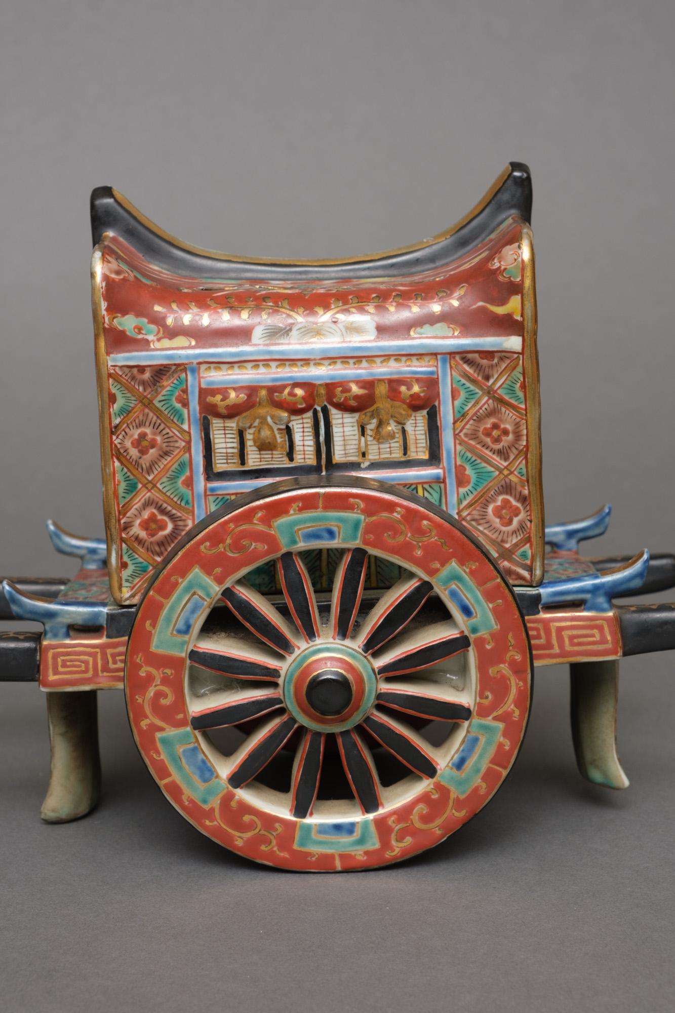 A wonderful and delicate Kyô’yaki porcelain kôro (incense burner) in the form of a gosho’guruma (ox-drawn carriage for Heian-era nobles).

Constructed in several detachable sections, decorated with geometric and floral designs in green, iron-red,