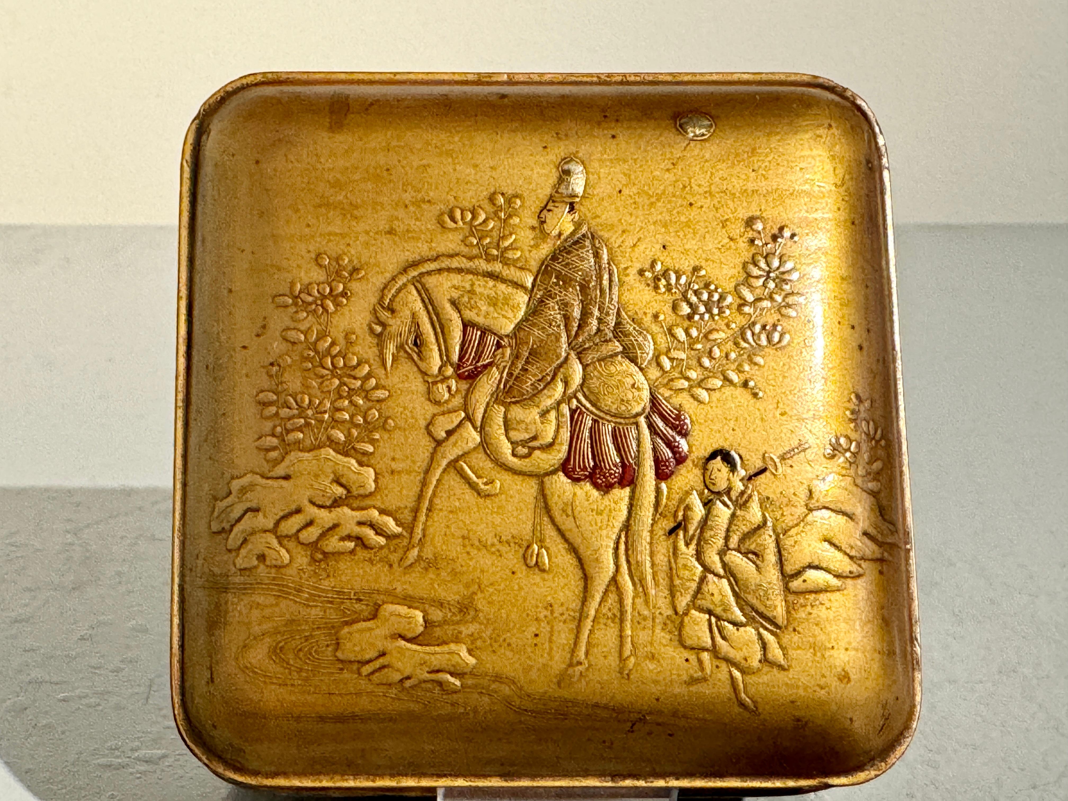 A fine Japanese small lacquer box for precious incense, kogo, Edo period, mid 19th century, Japan.

The small box of gold lacquer and wonderfully decorated with a scene in raised takamaki-e lacquer from the Tales of Genji, Chapter 13: Akashi. 

This