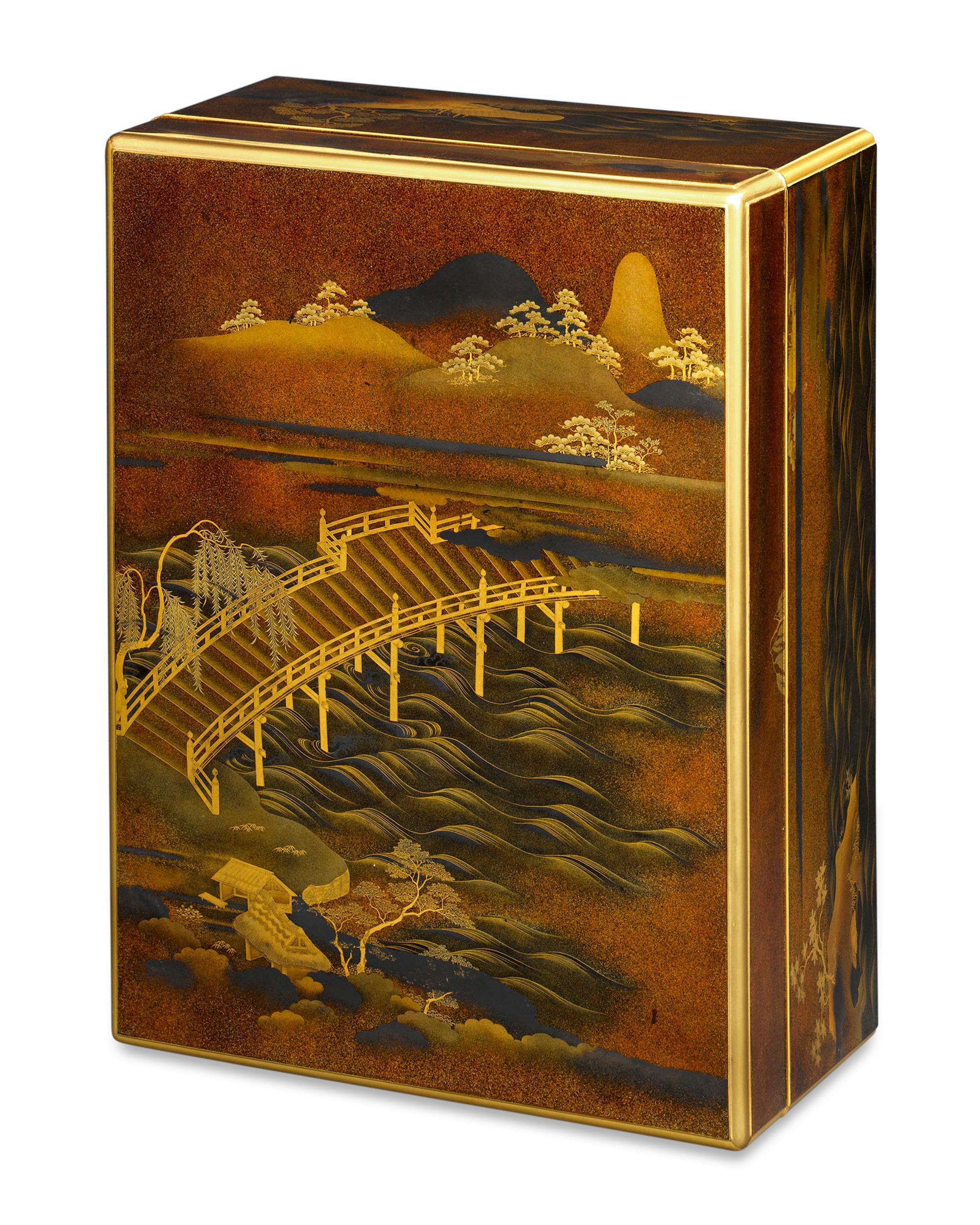 This monumental Japanese lacquer-ware document box is a work of extraordinary artistry. Displaying an exquisite beauty thanks to its tranquil landscape scene, this luminous, Meiji-period container is executed in a range of skillfully wrought lacquer