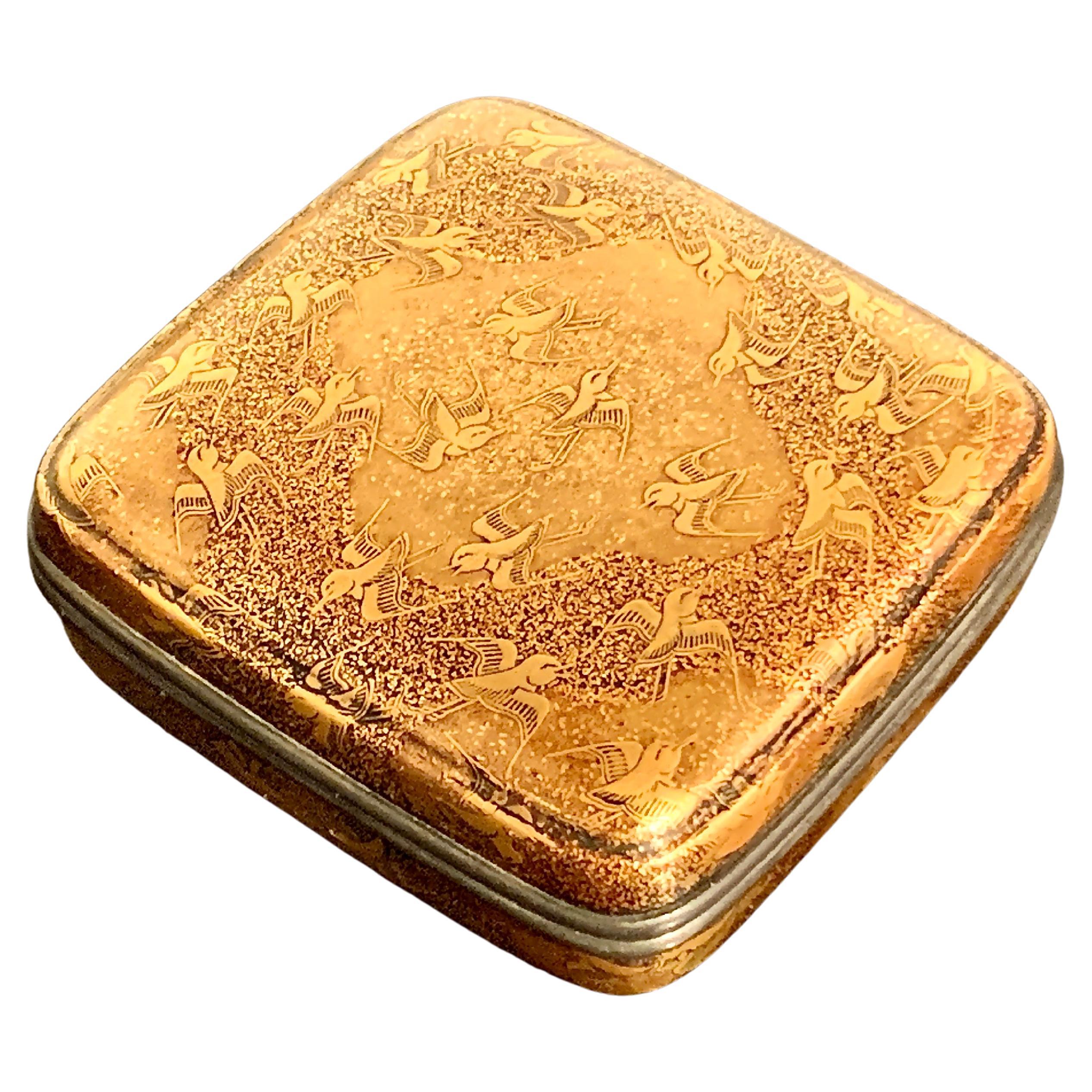 A wonderful Japanese lacquer incense box, kogo, with a design of plovers in flight, late Momoyama or early Edo Period, circa 1600, Japan.

The small box, called a kogo, was used to store precious incense. Crafted in rich and finely worked maki-e