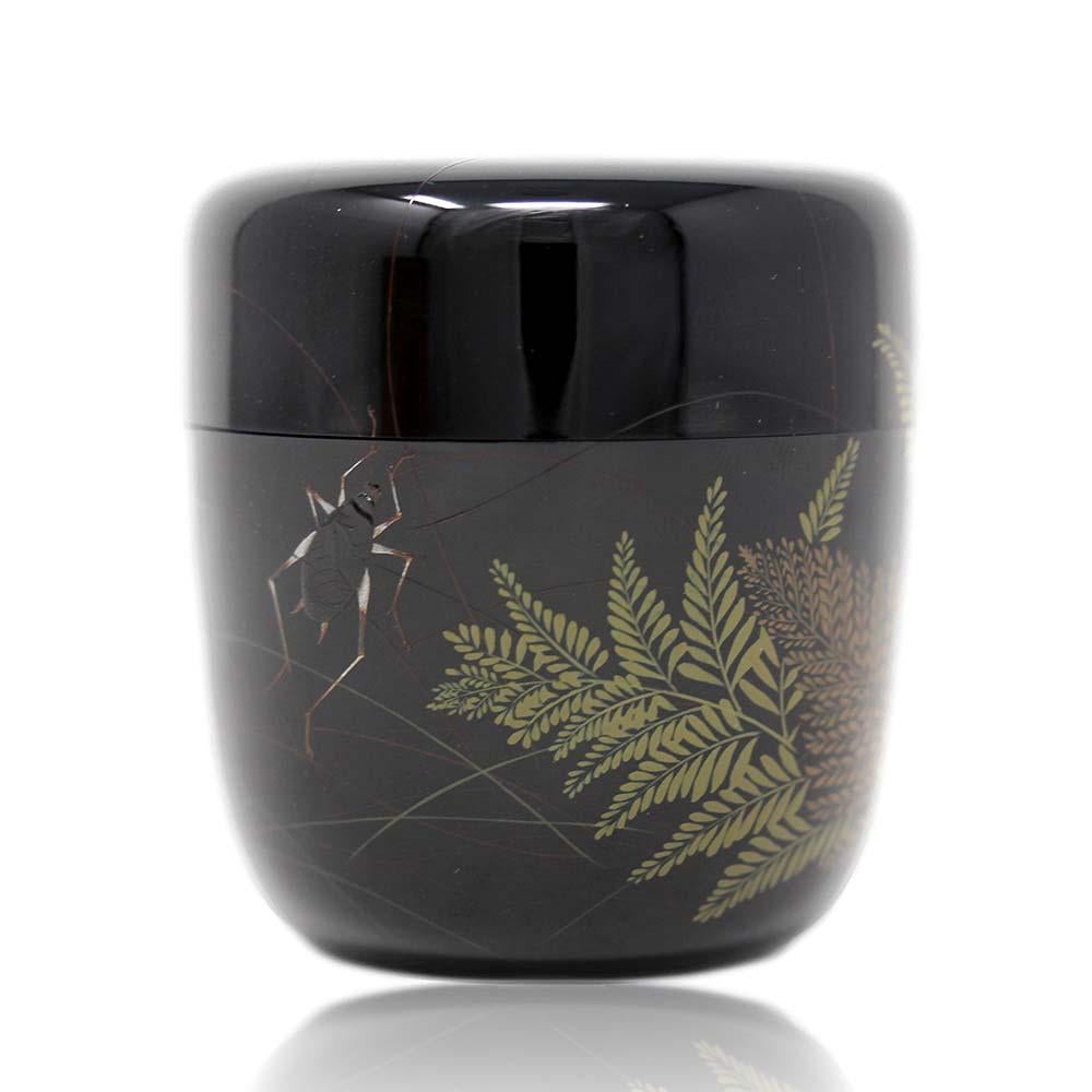 Fine Japanese black lacquer natsume by Saratani Tomizõ circa 1970. The lidded tea caddy with rounded edges and flat base with two suzumshi (bell crickets native to Asia) of exceptional detail with long antennae stretching across a large proportional