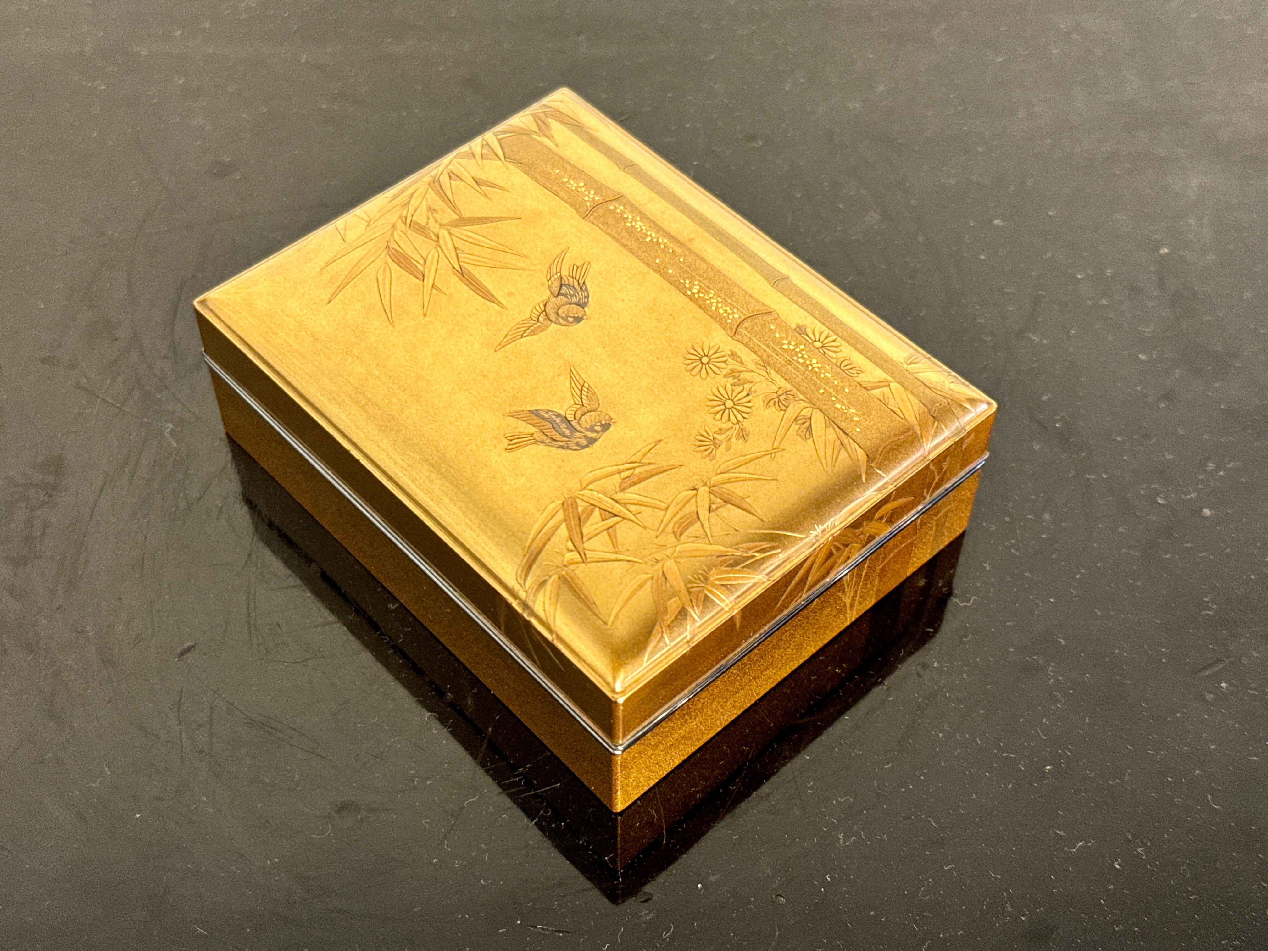 A fine and elegant Japanese gilt maki-e lacquer box for incense accessories, kobako, late Edo period, mid 19th century, Japan.

The fantastic small box of rectangular form, with a slightly domed lid and silver rims. The box is decorated all over in