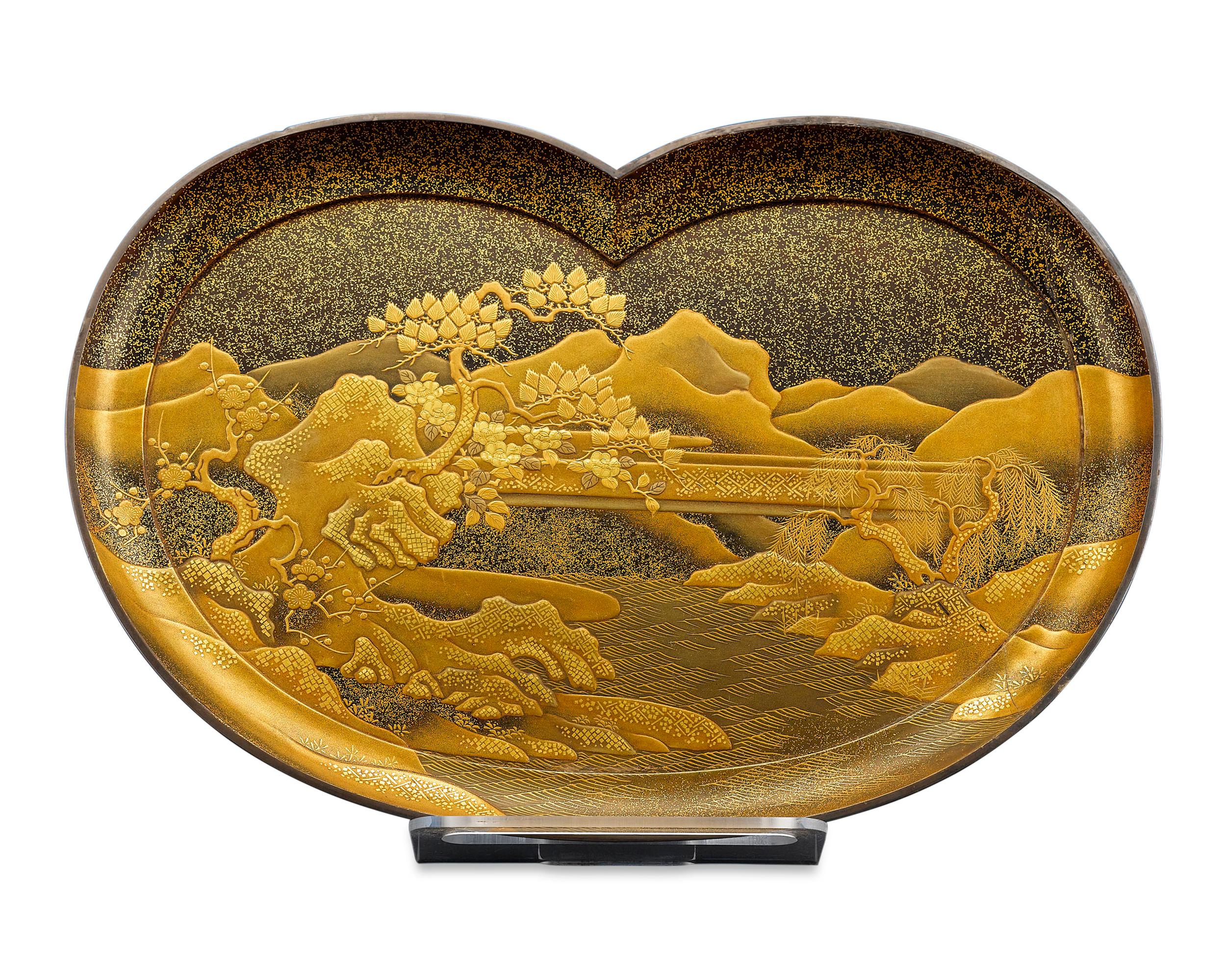 As beautiful as it is practical, this Japanese Meiji-period lacquered tray is distinguished by its exceptional craftsmanship. It exhibits a phenomenal artistry as the entire tray is enveloped with nashiji, hirame and kirikane decoration of a