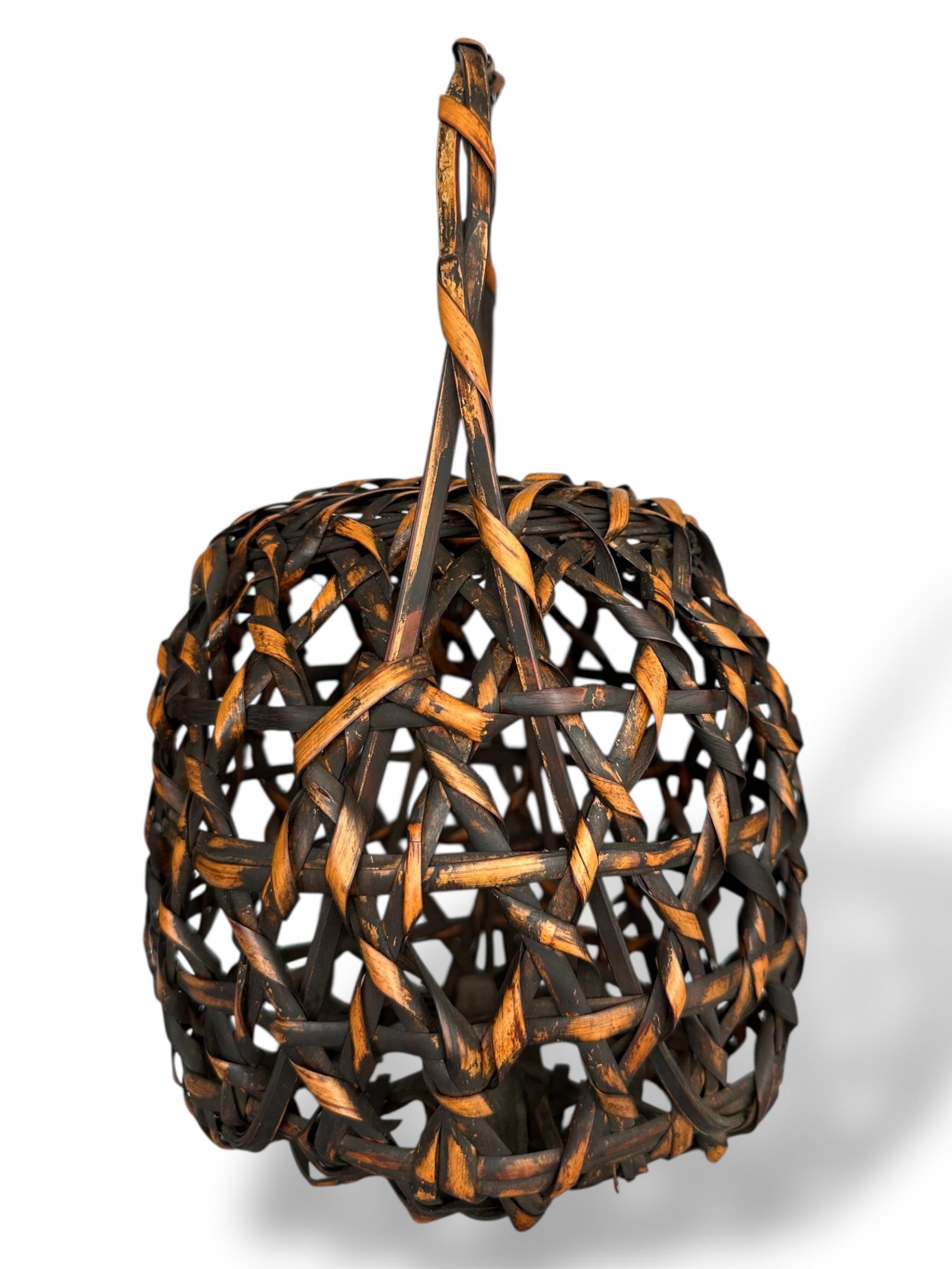 Showa Japanese Lacquered Bamboo Basket with Twisted Handle For Sale