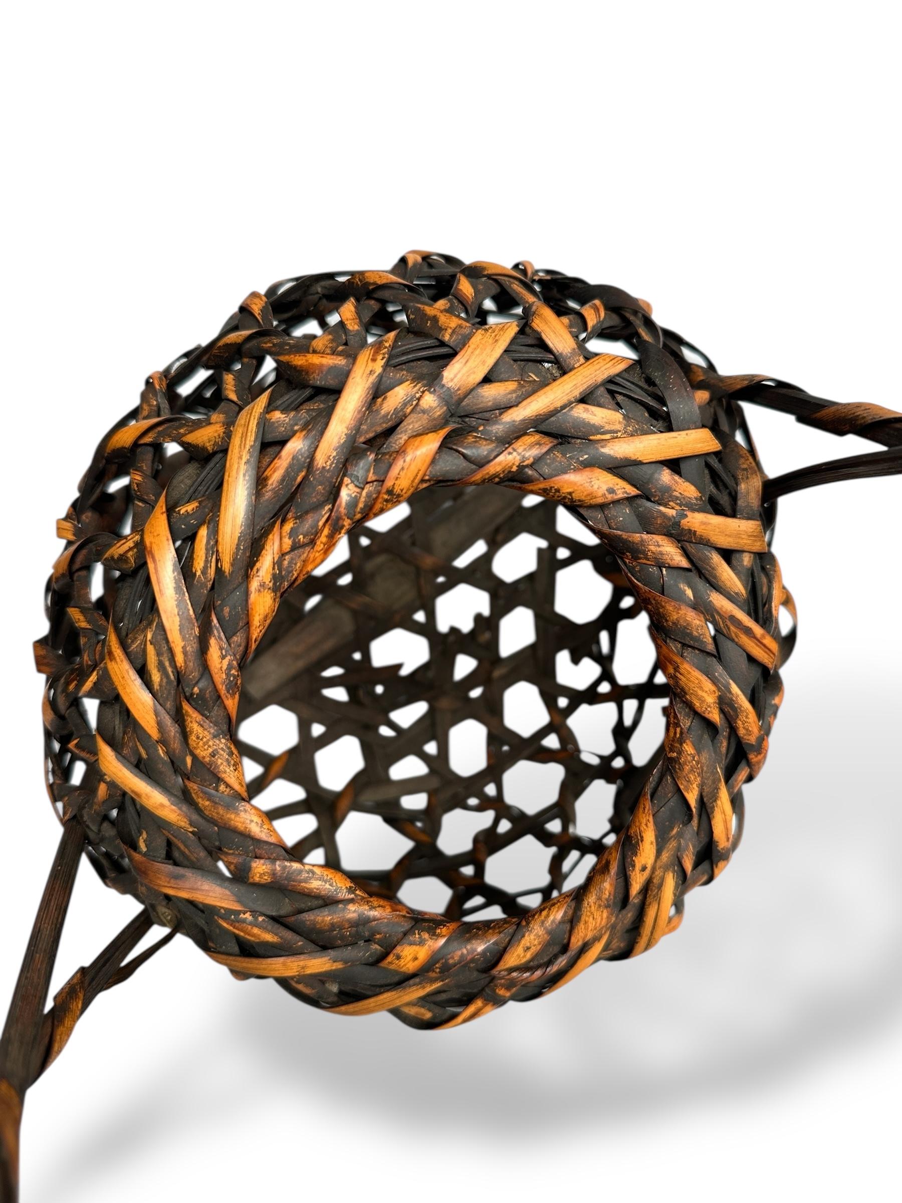 20th Century Japanese Lacquered Bamboo Basket with Twisted Handle For Sale