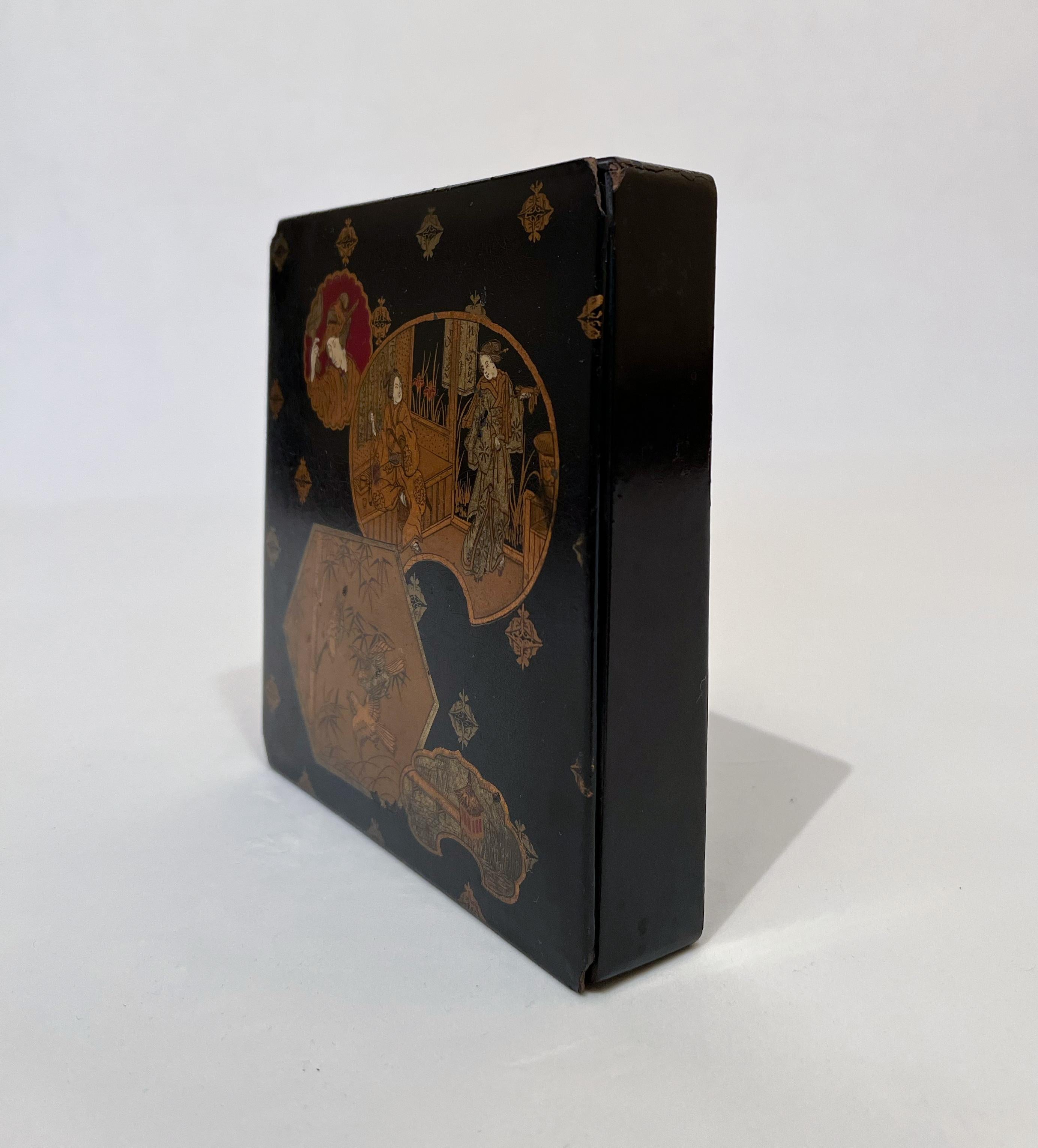 Black and gold Japanese lacquered 1900 jewellery box in perfect condition. 
Lacquer is an object made of wood, ceramic or other materials, usually domestic or sacred, coated with lacquer, which gives it a smooth, shiny surface. Lacquering of objects