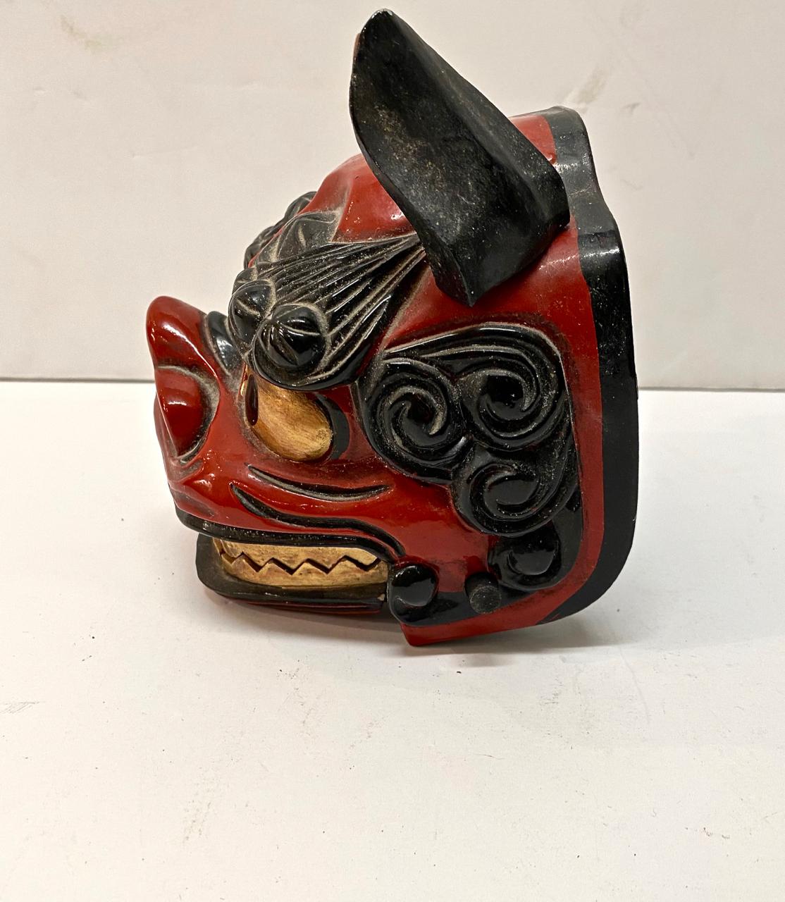 Traditional Japanese lion mask dating to the mid-20th century. The masks is in overall very good condition and would make an eye-catcher decorative element. Lion masks were used in the performance of the lion dance of the Matsuri Festival. The