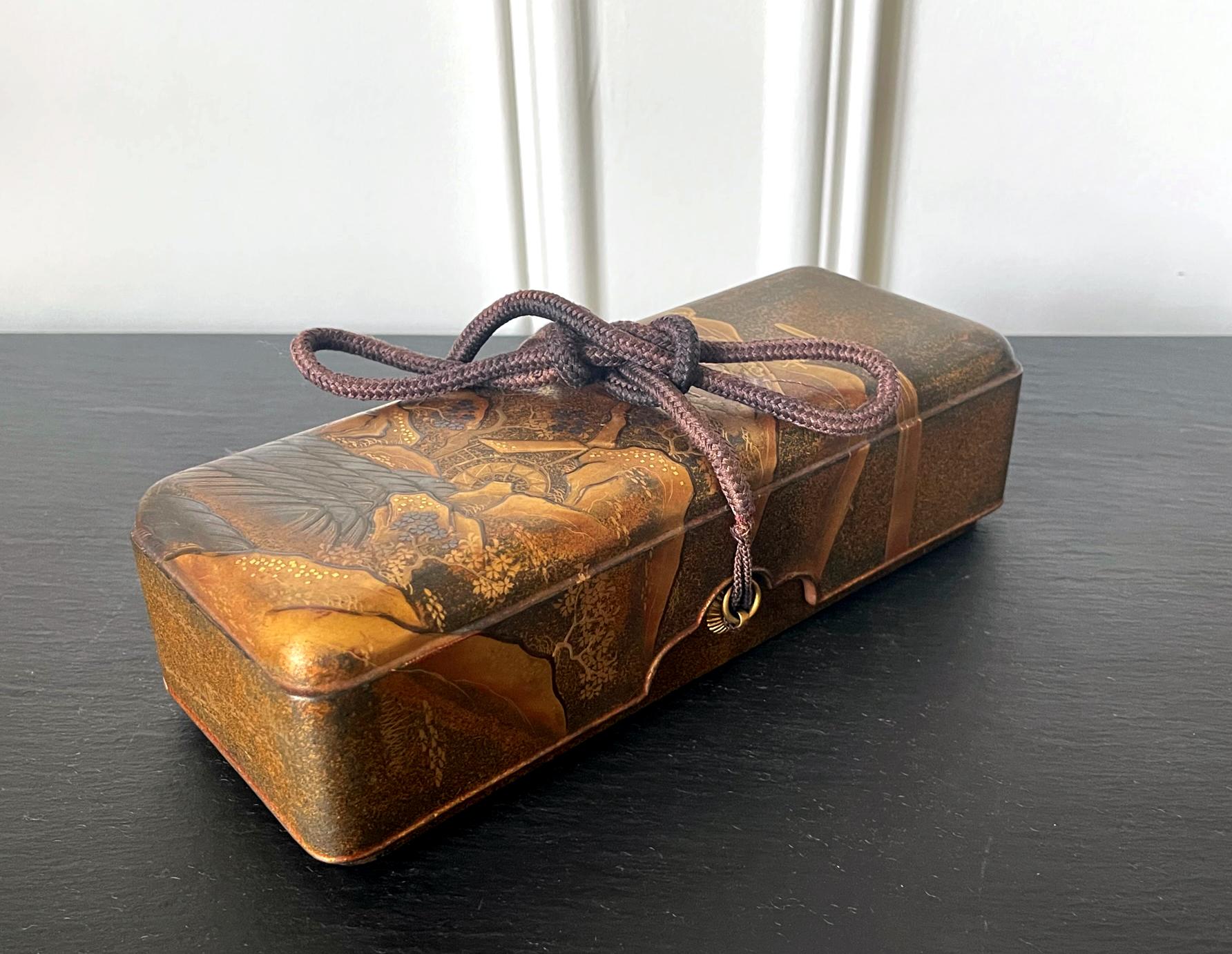 A Japanese lacquered wood fubako (a box used to store document or small scroll painting), circa second half of 19th century late Edo period. The rectangular box features an unusually deep lipped lid with slightly rounded corners, a conforming lower