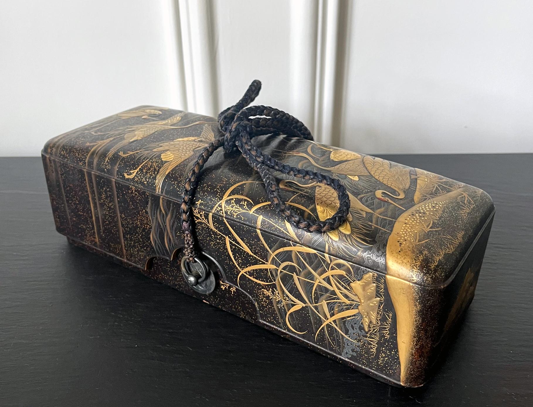 A Japanese lacquered wood fubako with fine maki-e decoration (Fubako is a box used to store document or small scroll painting), circa 18th century Edo period. The rectangular box features a deep lipped lid with slightly rounded corners, a conforming