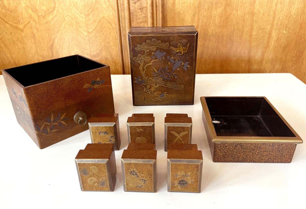 An antique set of Japanese tebako (hand box) with maki-e lacquer design circa 18th century Edo period. Tebako was known as hand box, which often consists of many individual sub-boxes, containers and compartment for the purpose of storing cosmetic