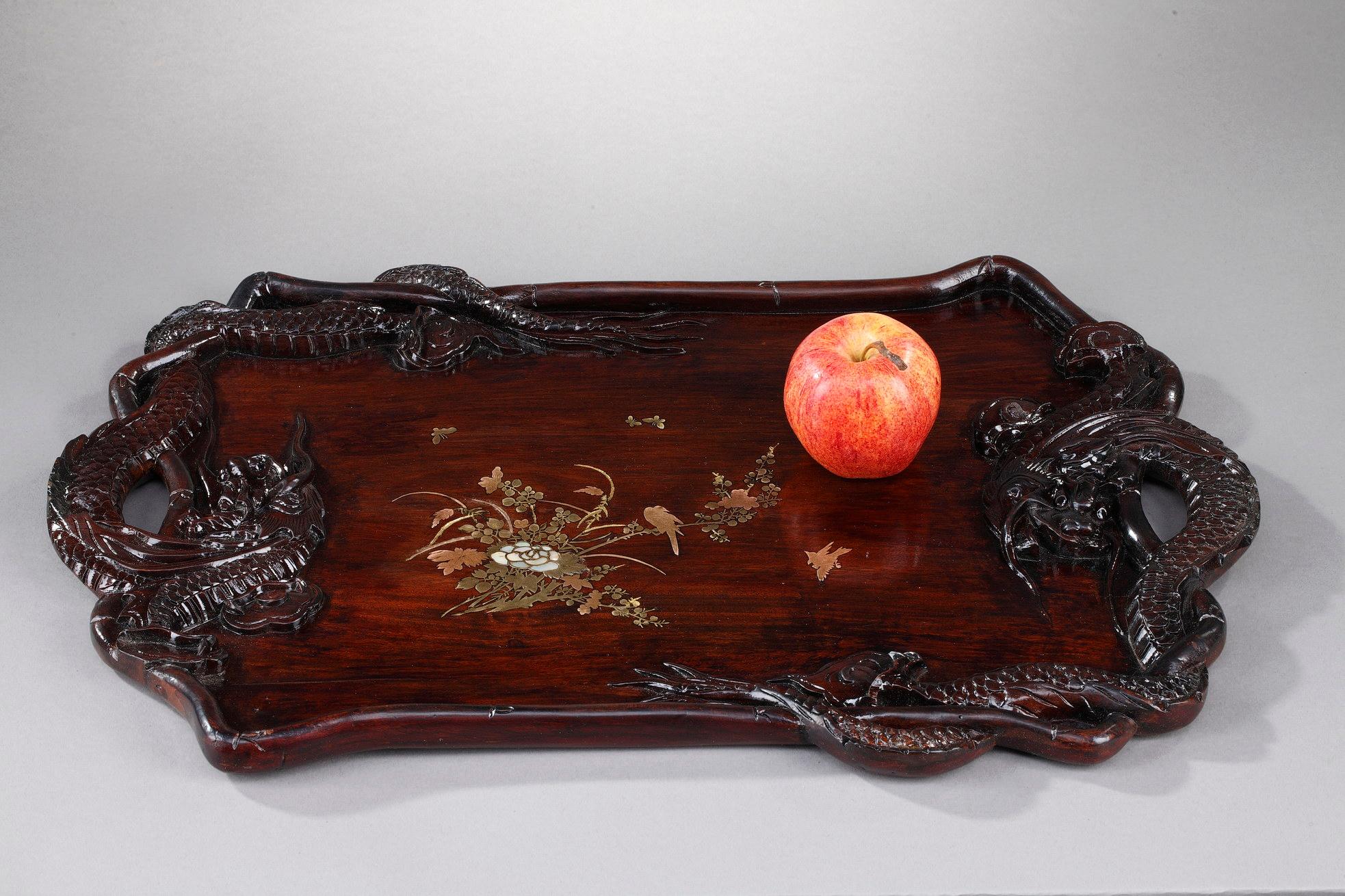 Lacquered wood tray with Japanese decoration with mother-of-pearl marquetry in the taste of Gabriel Viardot. The handles are carved in the shape of dragons. The border imitates the joints of the bamboo with engravings. The center of the tray is
