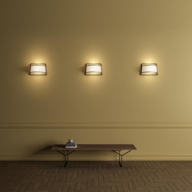 Code 551.44 
Collection of lamps revisiting traditional Japanese lanterns, characterized by a minimal and elegant style and available in four versions for any environment, floor (in two varieties) or wall and table. The structure is made by metal