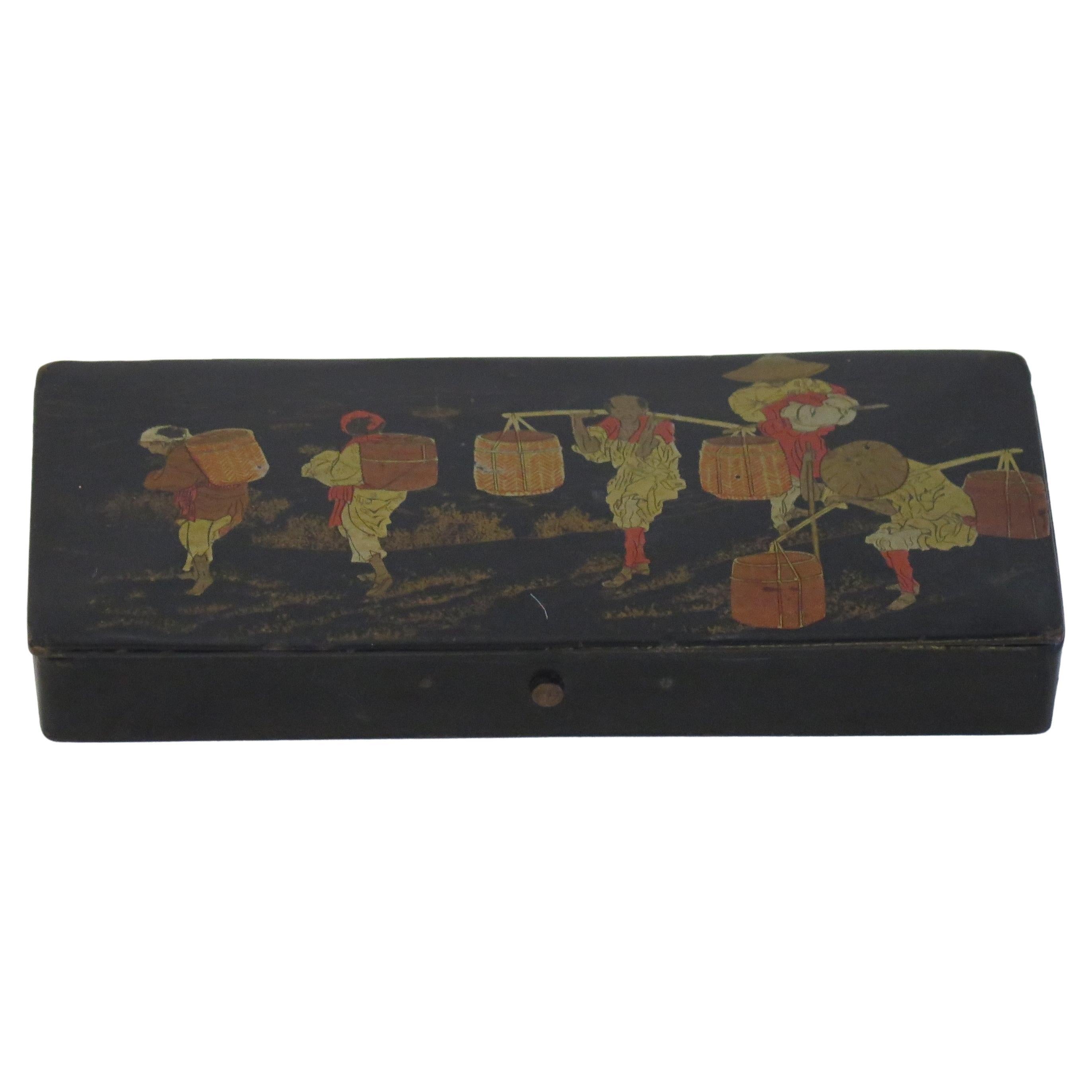 This is a good papier mâché, rectangular shaped black lacquered box with a hinged lid, hand enamelled and gilded, made in Japan during the 19th century, early Meiji period.

This rectangular shaped papier mâché box has a well fitting hinged lid,