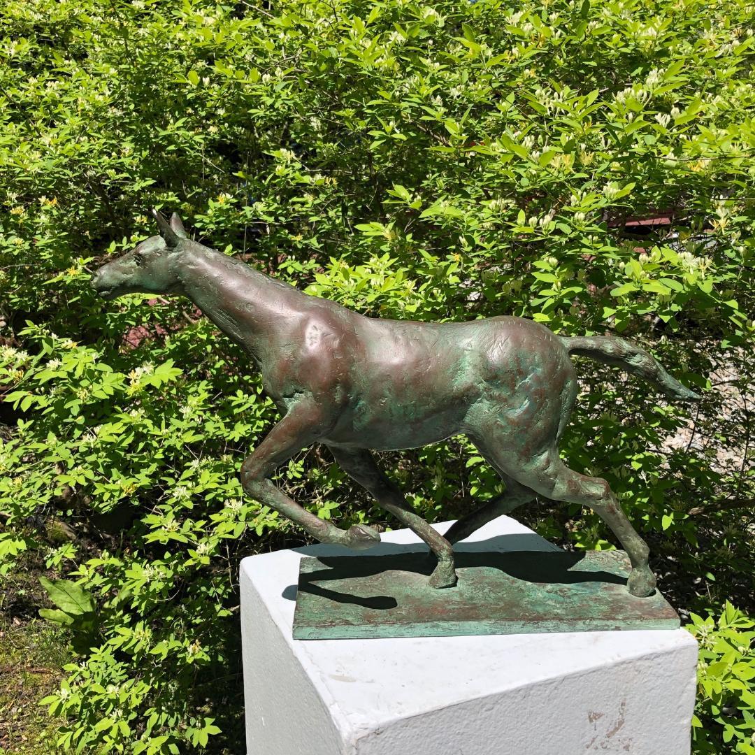 Japan, a fine handsome bronze effigy of a galloping, racing horse from the Taisho period (1912-1926), signed 
