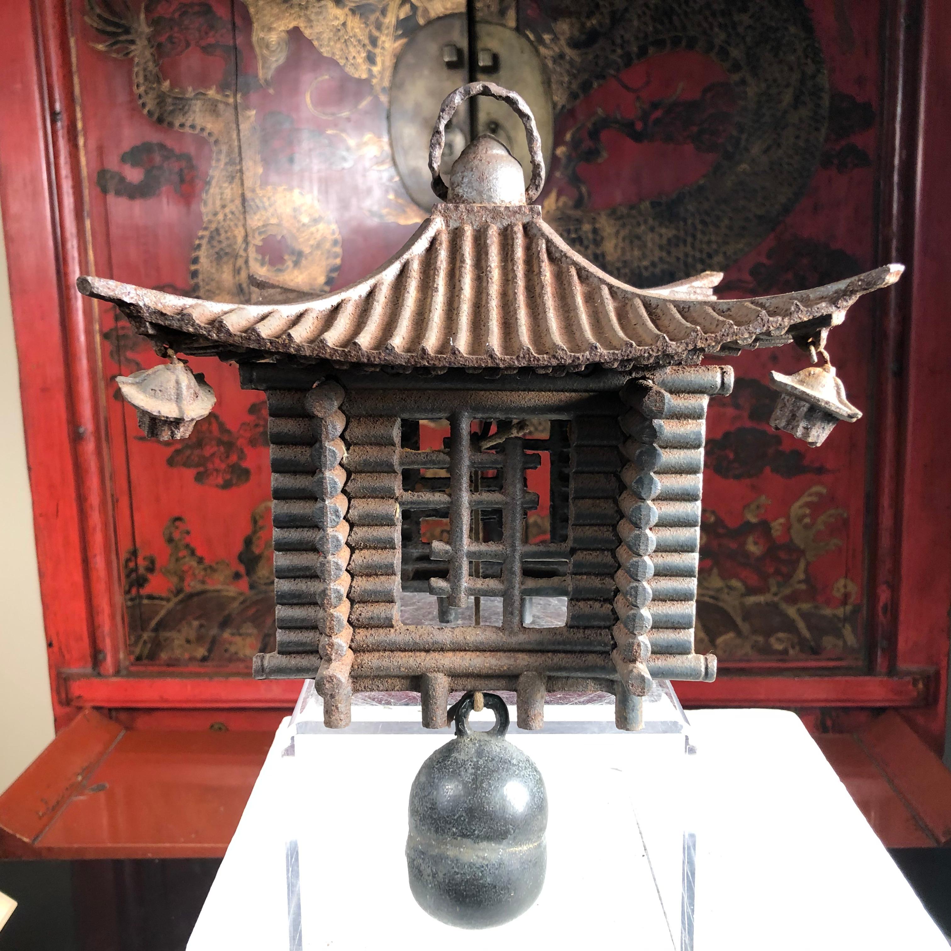 A first of its kind.

Japan, an unusual hand cast ringing lantern or wind chime in the form of a Japanese mountain cabin that may be suspended or placed on any surface in your favorite indoor or outdoor space. 

Includes a lovely old hanging