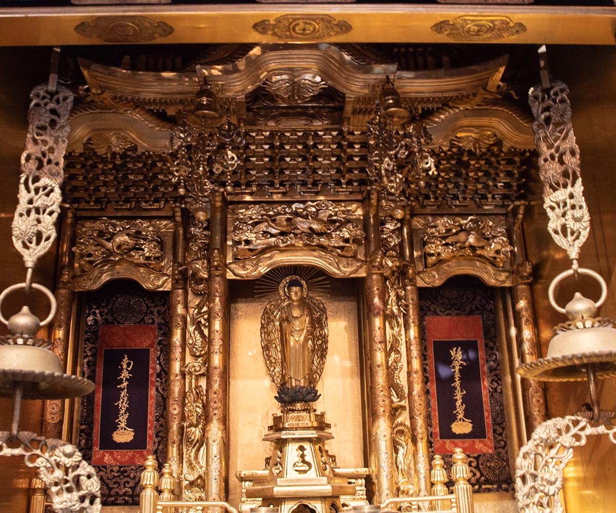 Offered is this absolutely magnificent Japanese Shrine that is very intricately hand carved and has the most glowing gold gilt work one will find in such a piece. It features a Buddha in a magnificent setting which has all the accoutrements of a