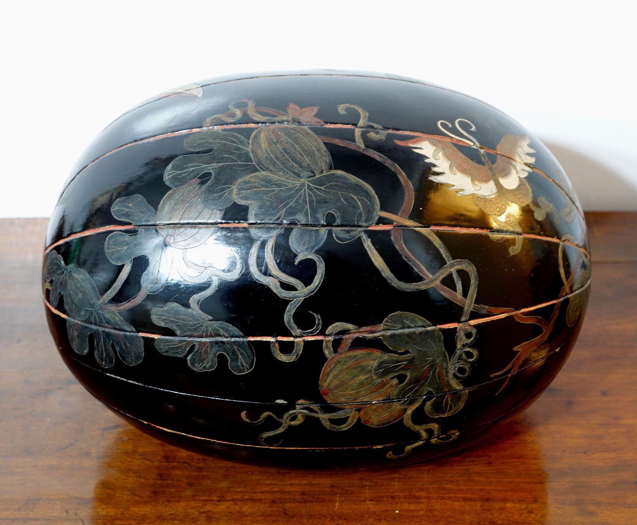 Japanese Large Lacquer Box with a Cover in Melon shape, depicting the melon with ivy branches, leaves, and butterflies. 