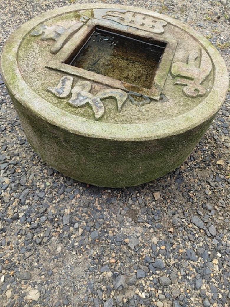 Big, old and unusual spiritual  “Zenigata” Stone Temple Tsukubai Water Or Plant basin 

Call or message us to reserve- now en route in our container from our Kyoto warehouse

Japan, a handsome old  larger scale 21 inch diameter round granite stone