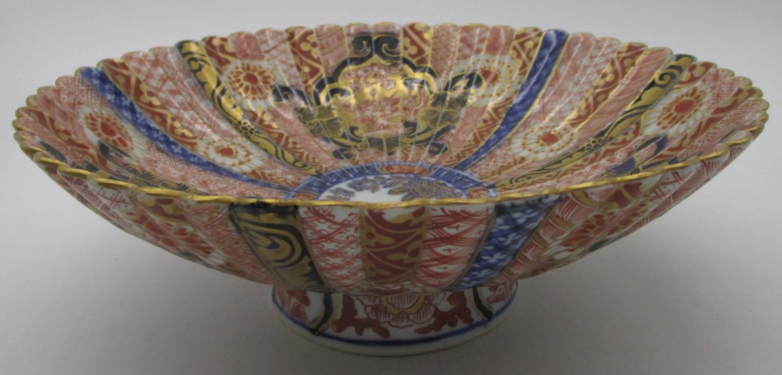 Exceptional Japanese late-19th century Meiji period signed Imari raised and ribbed porcelain deep charger, circa 1875, extremely intricately hand-painted on both sides in cobalt blue underglaze and polychrome enamelling in red and generous