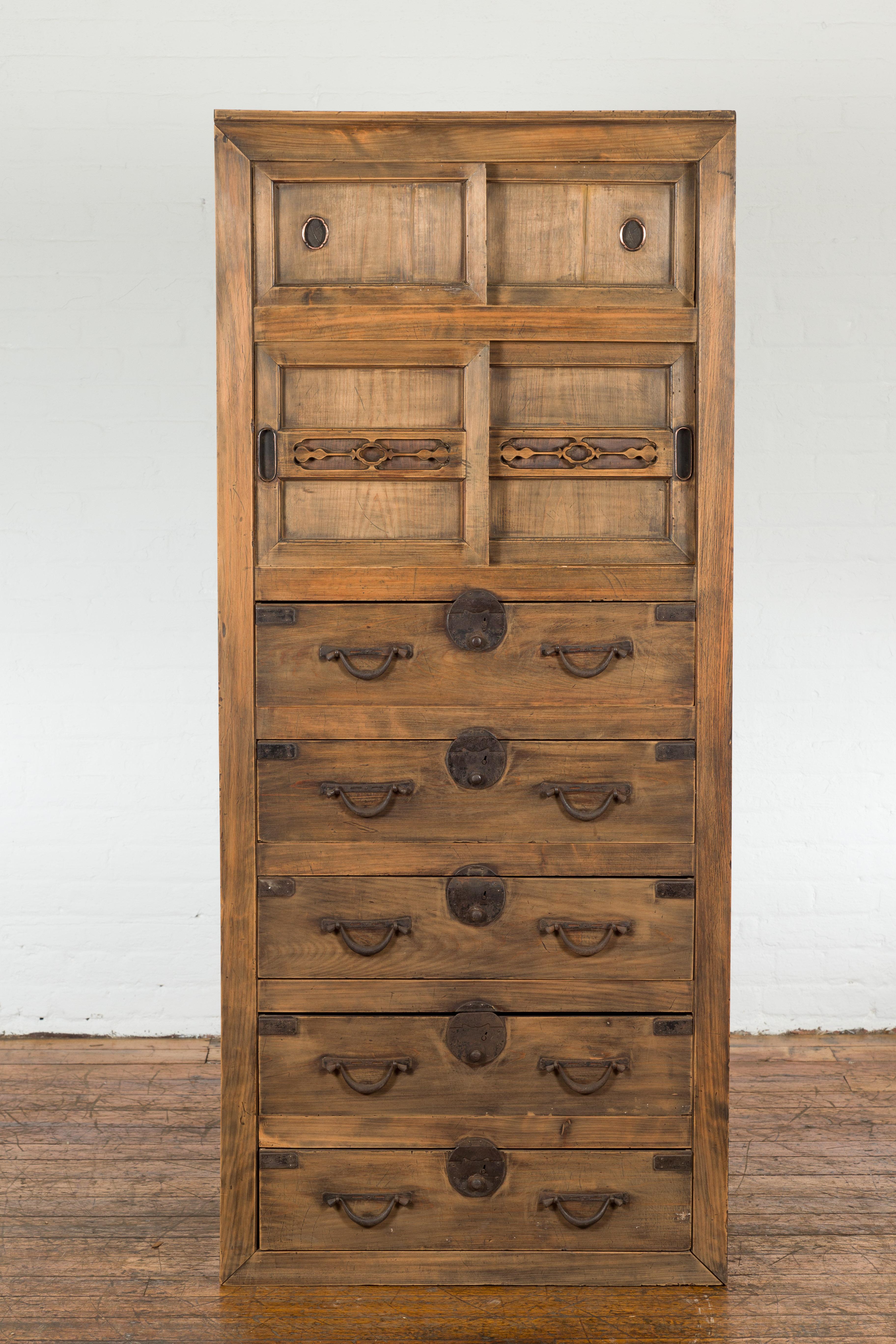 Carved Japanese Late Meiji Period Tansu Clothing Chest with Sliding Doors and Drawers