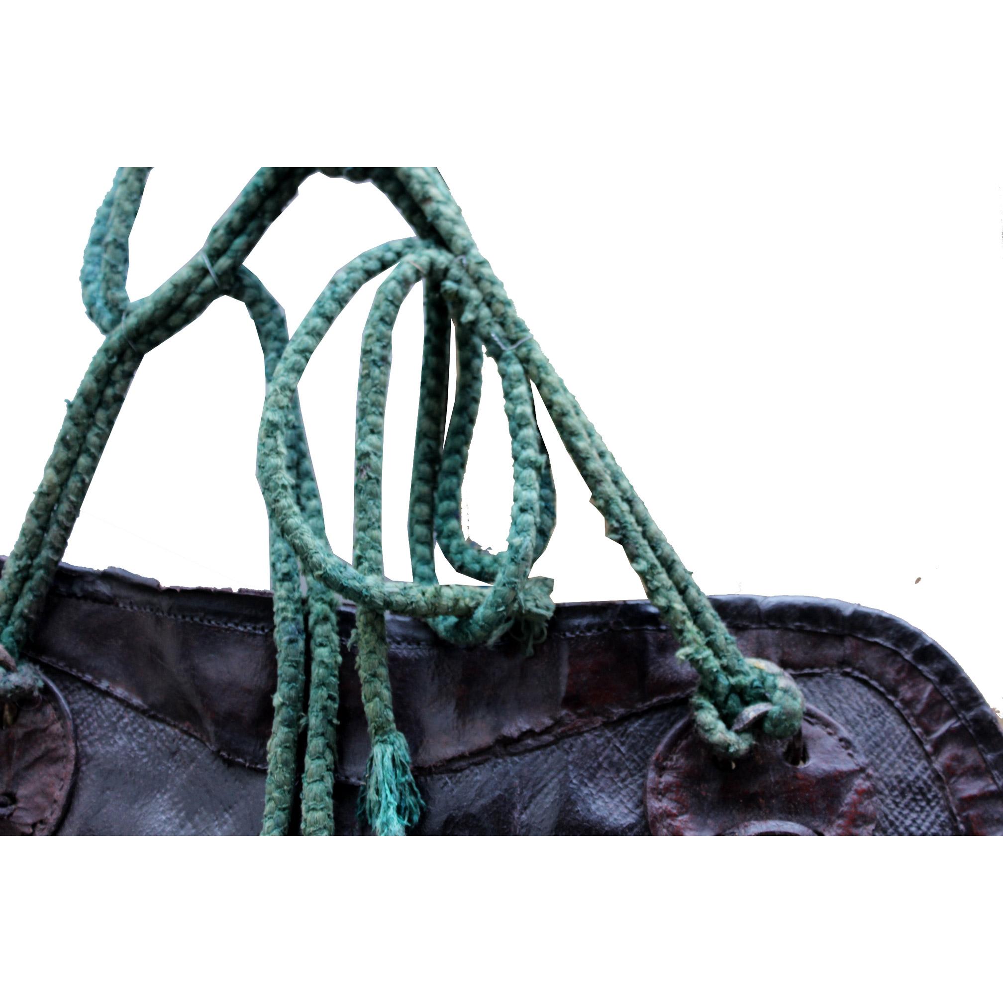 Dark brown leather saddle bag with floating red cherry blossoms and green rope was used by horsemen in the early 1880s in Japan. Meiji period, circa 1885.

    