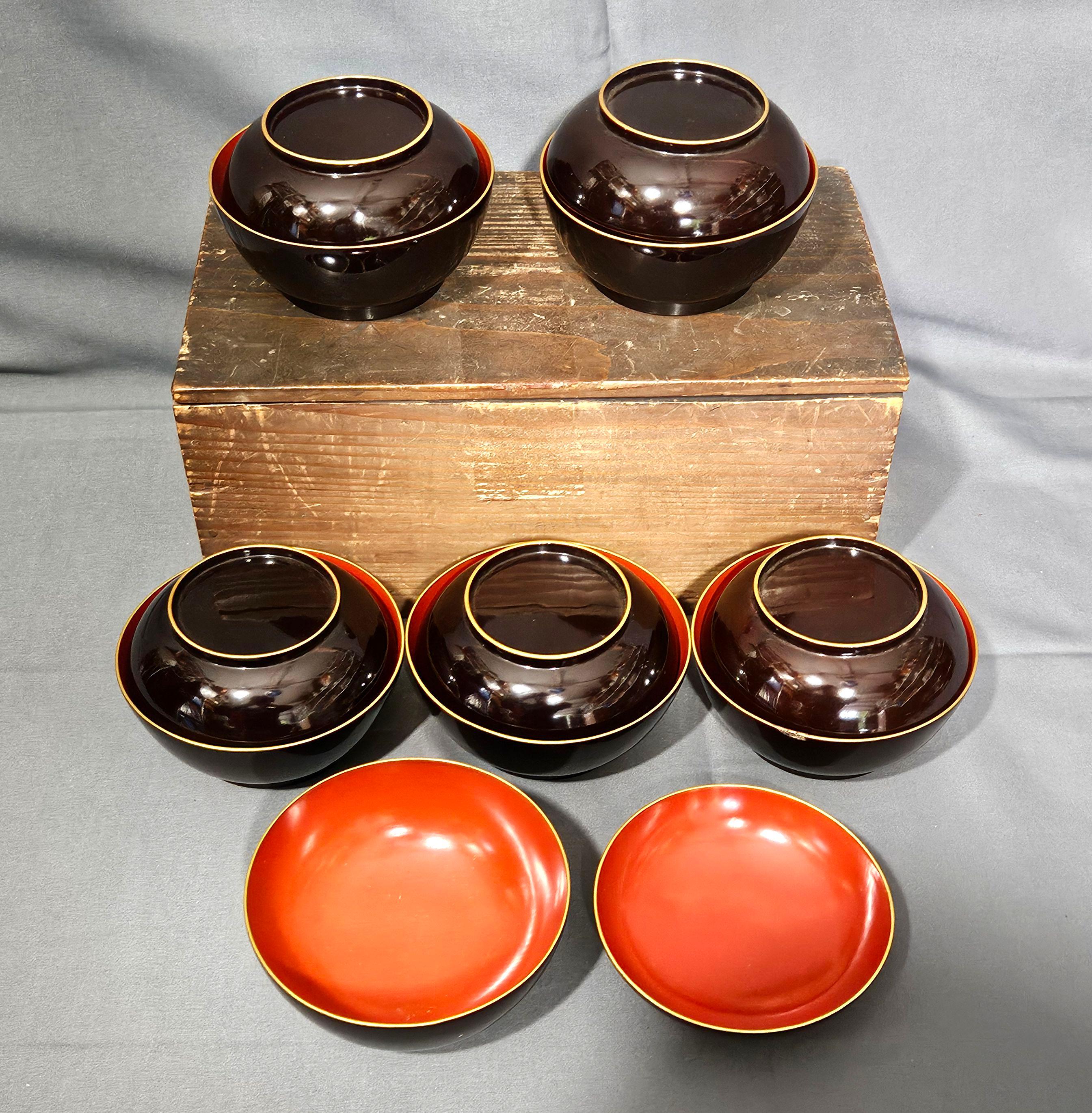 6 Sets of Japanese black Lidded Rice Lacquer Bowls with Covers and the original lidded wooden box from the 19th Century. There are a total of 12 pieces. 
There is one small paint loss on one bawl ring.
They are still in the new condition, and have