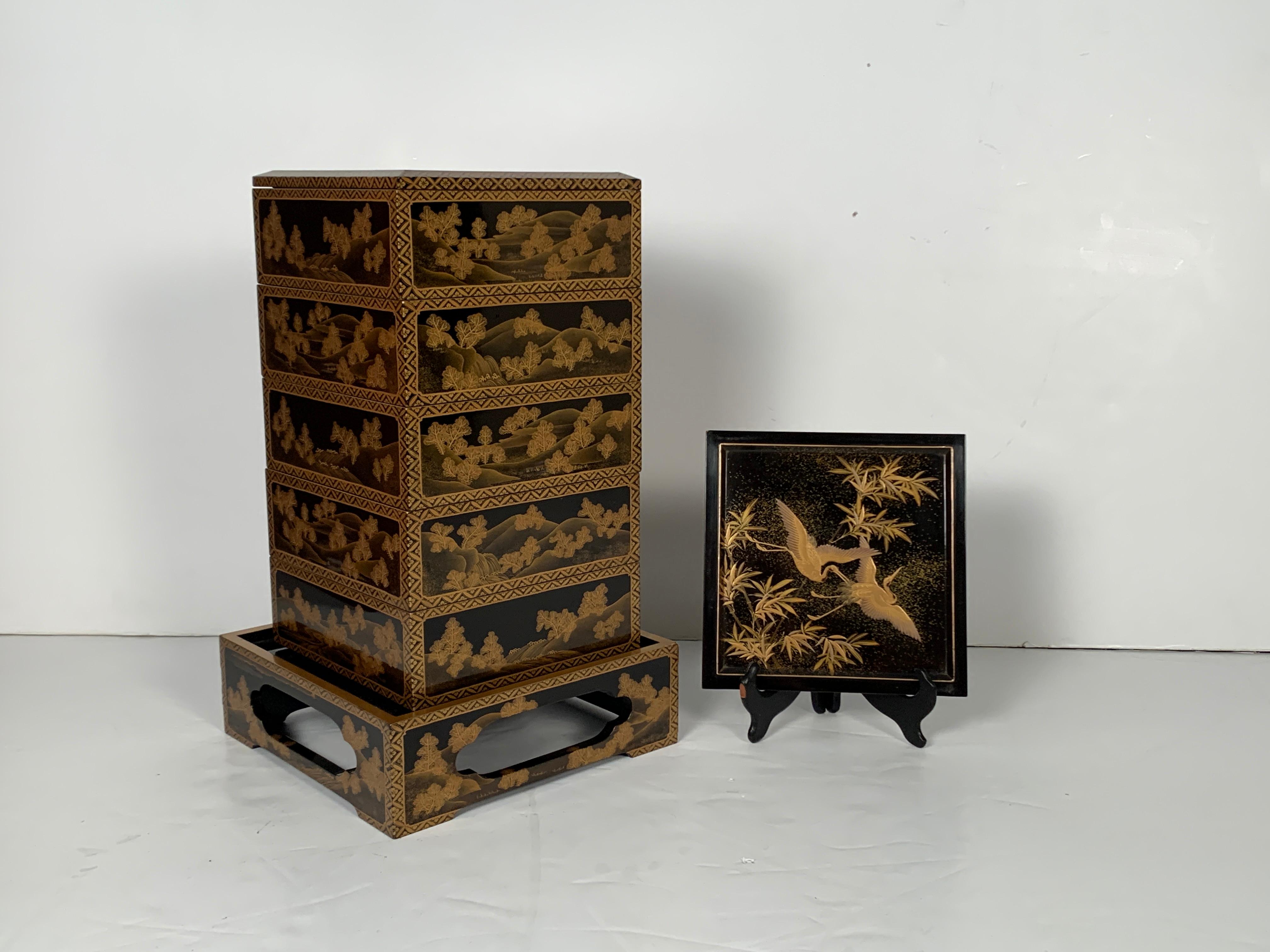 A fine and impressive Japanese gold maki-e decorated black lacquer five-tier jubako with presentation tray, two lids, and the original tomobako storage box, Meiji period, late 19th century, Japan.

The jubako, or stacking box, is sumptuously