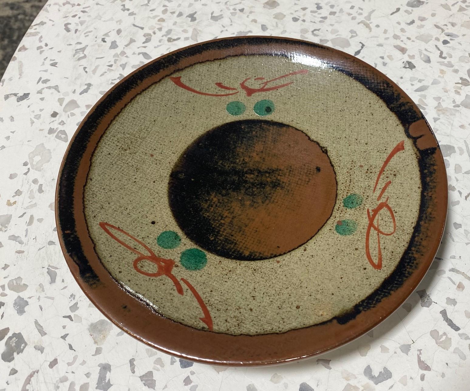 A wonderfully decorated and executed Mashiko pottery low bowl/ plate attributed to Japanese National Treasure pottery master Tatsuzo Shimaoka (this work is not signed/marked but his earlier works were not signed). This work exhibits his signature