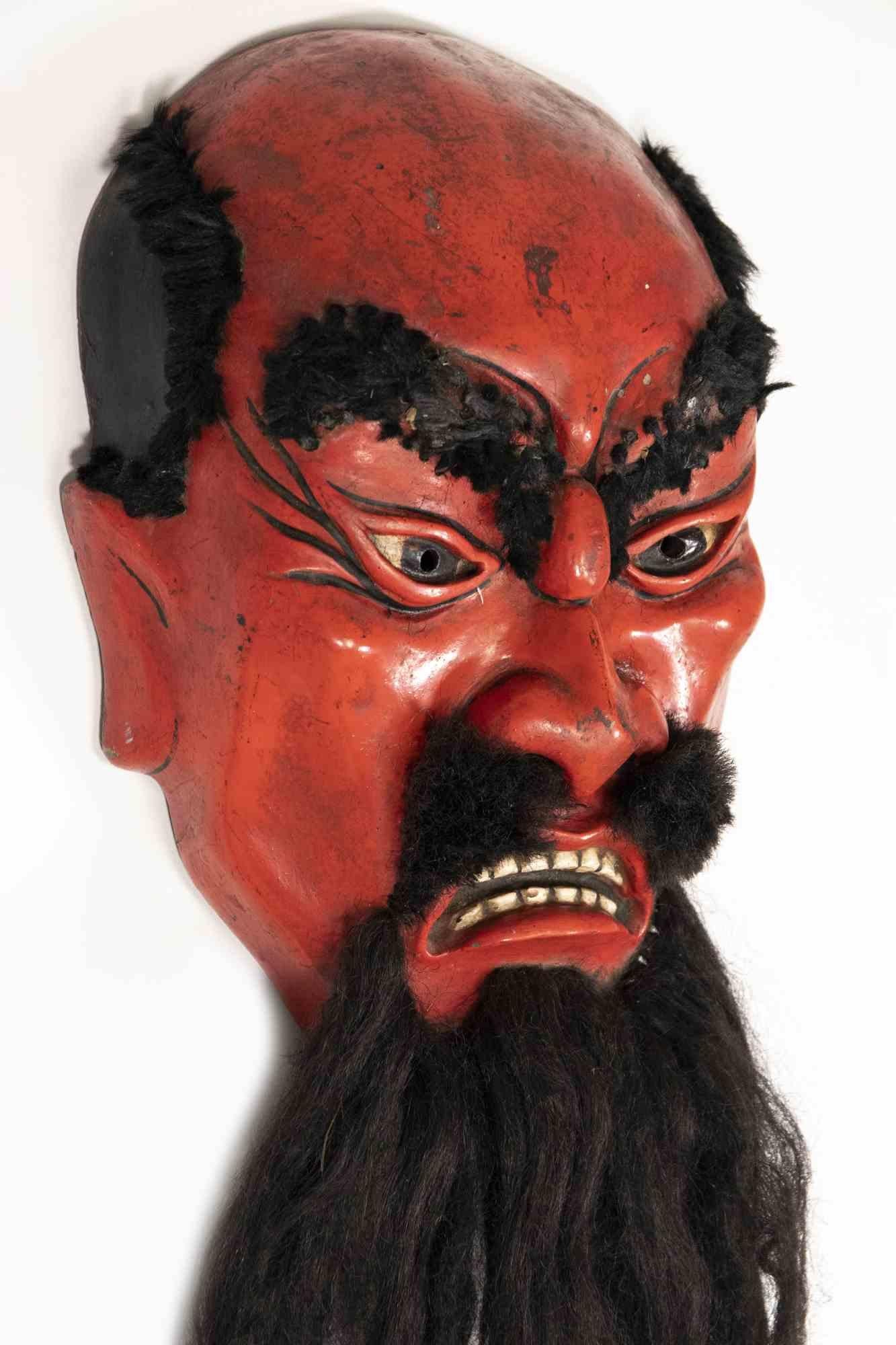 Japanese Mask is an original decorative object realized by Anonymous Japanese in the half of 20th century.

A vintage mask in wooden and with reproduced beard.

Good conditions except for some lack of colors.