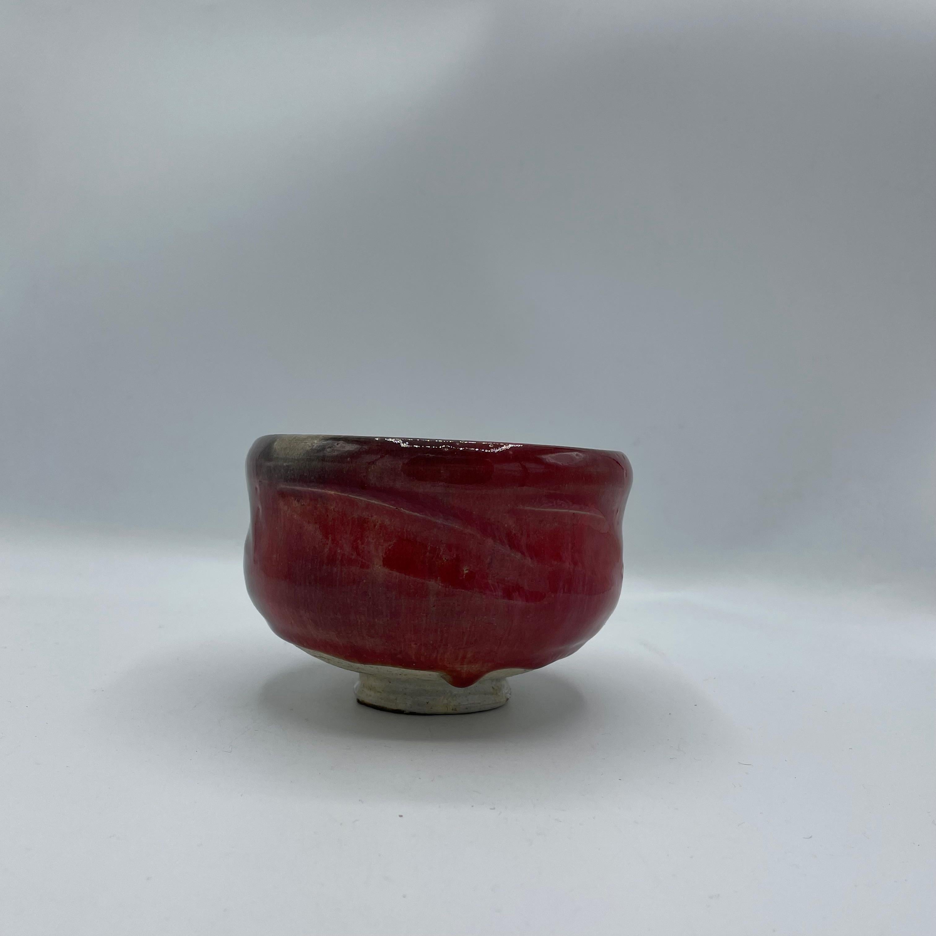 This is a Matcha tea bowl which we use during a tea ceremony.
This bowl was made with style Raku (Raku ware).
This is made with porcelain. 

Raku ware is a type of Japanese pottery traditionally used in Japanese tea ceremonies, most often in the