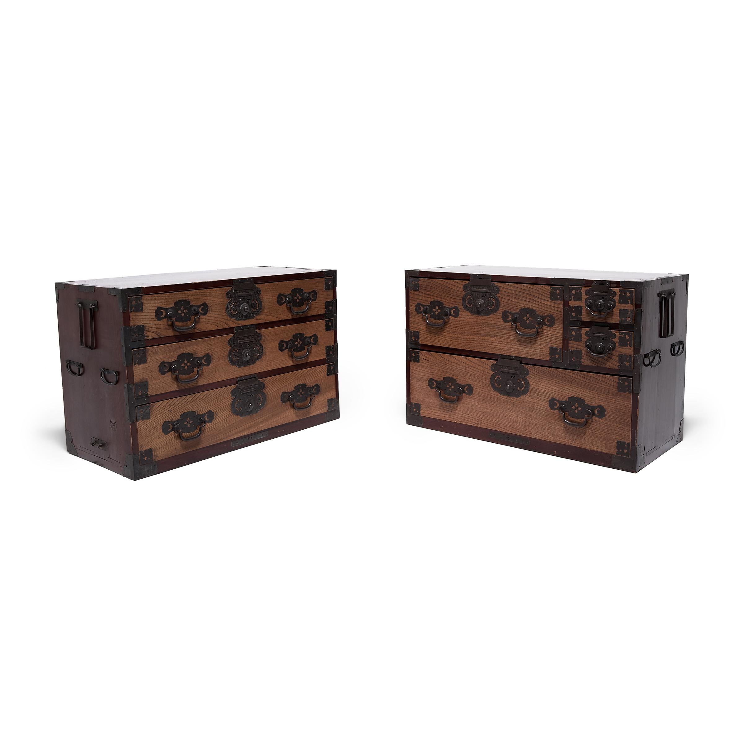 Designed to be versatile and portable, Japanese tansu chests were multipurpose storage cabinets that moved throughout the home as needed. Dated to the late 19th century, this Meiji-era example is a lacquered chest-on-chest clothing tansu (isho