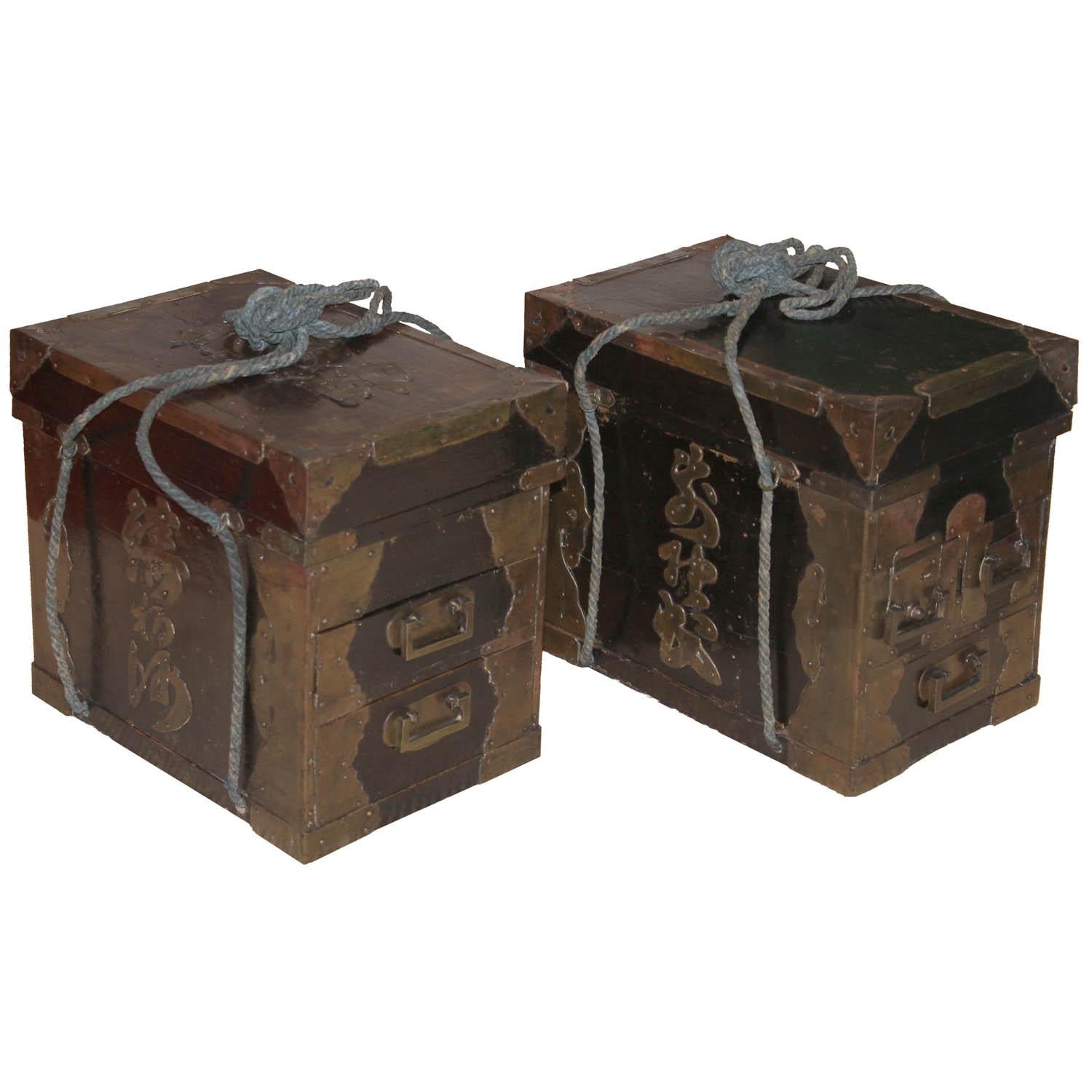 Pair of Japanese black lacquer medicine boxes with copper lettering of the owner, Seinsuke. Medicine salesman would carry the boxes on each end of a pole resting on his shoulders and go door to door selling his wares. Meiji period, circa 1890s.