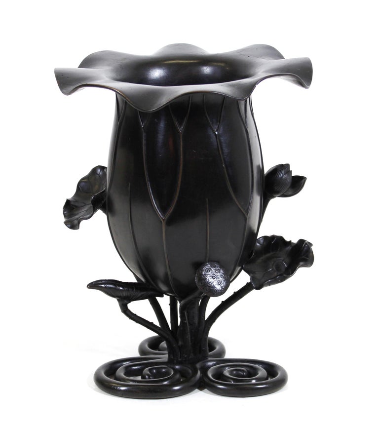 Japanese Meiji period lotus vase with realistic buds and leaves growing out of the water, with rich black patina, circa 1900.